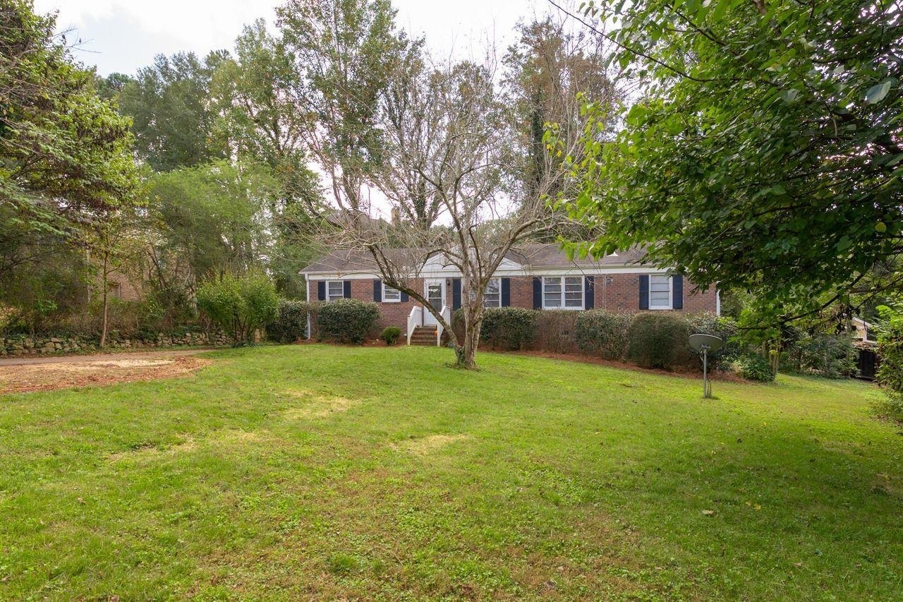 Beautiful, well-maintained, brick front, one-level, ranch home in sought-after West Cobb. Hardwoods throughout main level, renovated kitchen with new stainless appliances, granite countertops and eat-in bar with open view to dining/great room. Tankless hot water heater, additional room with brick fireplace is perfect for extra entertaining, office or gym space. Close to Marietta Country Club, Barrett Pkwy, with easy access to expressway, shopping, schools and downtown Atlanta. No HOA.