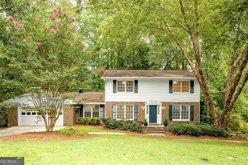 Tucked away on a quiet cul-de-sac in the sought-after Dunwoody Elementary district, this move-in ready home offers the perfect blend of charm, convenience, and space. Just a short walk to schools, places of worship, and the JCC, it's ideally situated for everyday living. Freshly painted inside and out, the home features beautiful hardwood floors on both levels. The main floor offers a large living/flex room, a bedroom with full bath, and a spacious fireside great room with front-to-back windows that fill the space with natural light. The newly upgraded kitchen has brand-new granite countertops, a new oven and dishwasher, and freshly painted cabinetry. Upstairs, you'll find a generous primary suite/bath, plus two additional bedrooms and full bath. Enjoy outdoor living on the newly stained deck overlooking a private, fenced backyard-perfect for play, pets, or gatherings.The daylight basement offers high ceilings and plenty of room for a gym, play area, or future finished space. An incredible value in one of Dunwoody's most convenient and desirable neighborhoods!