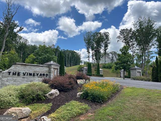 Welcome to The Vineyard at Yukon, one of North Georgia's most picturesque and desirable communities. Lot 95 offers 2.27 acres on a cul de sac of serene, private land with stunning mountain views-an ideal setting to build your custom dream home. Nestled in a peaceful and upscale community, this lot combines natural beauty with convenience and thoughtful development. This premium homesite features underground utilities for both power and water, ensuring aesthetic appeal and reliability for your future build. The location is directly across from Chateau Meichtry, a popular family-owned winery that enhances the charm and lifestyle appeal of the area. Imagine sipping local wine while taking in the surrounding mountain landscape-this is the North Georgia lifestyle at its finest. Residents of The Vineyard at Yukon enjoy access to exceptional community amenities, including a scenic mountaintop pavilion and a relaxing pool area, perfect for socializing and enjoying the views. The community is ideally located just minutes from the charming towns of Ellijay and Jasper, known for their vineyards, orchards, farm-to-table restaurants, and welcoming downtown districts. Lot 95 is more than just a piece of land-it's a rare opportunity to create a lifestyle that blends elegance, comfort, and natural beauty. Come build your dream home in this exceptional setting.