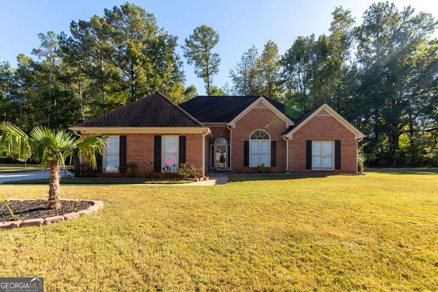 Discover the perfect blend of comfort and tranquility with this 4 bedroom, 2 bathroom brick-front ranch home at 50 Lydia Ct, Covington, GA 30016. Offering 1,783 square feet on a half acre lot, this 1996-built beauty sits in a quiet cul-de-sac of a quiet neighborhood with no HOA fees-ideal for those seeking a low-maintenance retreat.    Step inside to gleaming solid hardwood floors that, complemented by a cozy wood-burning fireplace with gas starter for those chilly evenings. The well-appointed kitchen boasts stainless steel appliances including a dishwasher and refrigerator, while central heating and cooling ensure year-round comfort. The master suite comes with a walkin closet, dual vanities, separate shower and large soaking tub.    Outside, the expansive lot offers endless possibilities for gardening, play, or simply unwinding in your private oasis, all just moments from Covington's vibrant shopping, dining, and entertainment options. Schedule your showing today and make 50 Lydia Ct. your home!