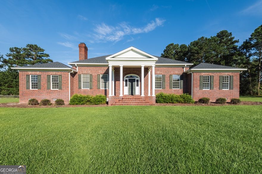 Executive Retreat on 14.6 Acres.  Welcome to your dream home estate featuring 4 Bedrooms, 3.5 Baths overlooking a tranquil pond and oak lined drive way.    Step inside to find thoughtfully designed floor plan featuring both a formal living room and a spacious great room both with beautiful  masonry fireplaces.  A sunroom overlooking the landscaped garden with brick fence and large patio, perfect for entertaining.  The beautiful kitchen flows into the dining room and living area with multiple pantries, lights below and above the cabinets, with solid surface countertops.  The kitchen features a large island with granite countertop and storage.  A built in desk has glass front cabinets above.   The luxurious master suite is a true retreat with a large walk in closet, Master Bath with separate shower, jetted large tub and double vanity.  Closet features 2 large custom built cabinets with shelves and drawers.   Three additional bedrooms offer ample space for family or guests.  2 bedrooms share a true jack and jill bath and another bedroom in a separate area with a private bath.  Perfect for guest, family or Mother in Law suite.  A 2 car garage has abundant storage and  a door to access the garden area. An outdoor building is included.   Enjoy the peace and privacy of wide open acreage- perfect for horses, gardens, or simply soaking in the views.  Whether you're relaxing indoors or exploring the outdoors, this property offers a rare combination of executive-level living and rural serenity.