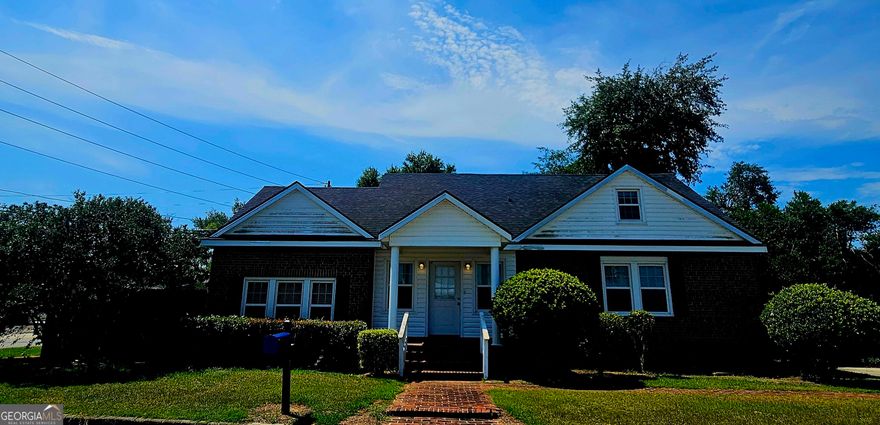 Has been used for both commercial business and residential, paved parking in front of home and also large privacy fenced backyard which could also be used as parking. Carpet is in good shape. New blinds in most windows. Lots of charm with built in shelves and bookcases. Selling as is