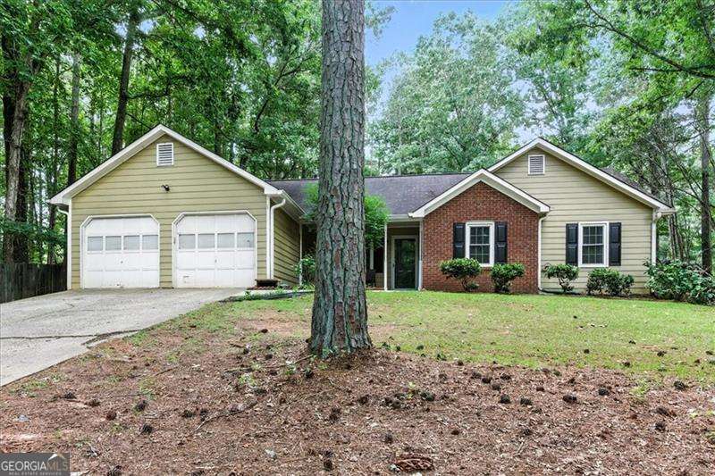 Charming Ranch on a Generous Lot in a Peaceful, No-HOA Neighborhood! Welcome home to this inviting 3-bedroom, 2-bath ranch nestled on a spacious, level lot in a quiet Powder Springs community. Recent updates include a 2023 HVAC system and durable LVP flooring for modern comfort and peace of mind. The bright white kitchen is both functional and full of character, featuring farmhouse sink, stainless steel appliances, butcher block countertops, and an adorable garden window-perfect for herbs or your favorite plants. The open-concept layout connects the kitchen to the dining and family room, where a cozy fireplace creates the perfect gathering spot. Step outside to a fully fenced backyard with room to relax or play. Enjoy the covered patio, pergola, a storage shed, and a separate workshop with electricity-ideal for hobbies, projects, or extra storage. Located in the Cobb County School District, this charming home offers flexibility and freedom with no HOA. Whether you're a first-time buyer or savvy investor, this is an excellent opportunity you won't want to miss!