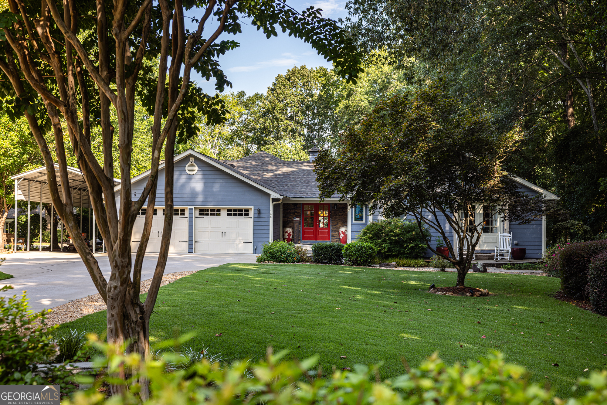 Nestled on a level lakefront lot, 146 Misty Lane offers the ultimate Lake Oconee retreat with 4 bedrooms, 3.5 baths, and 4,602 sq ft of luxurious living space. Recently updated with a new roof in 2023, this home blends modern convenience with timeless charm. Smart home features include Wi-Fi-enabled thermostats, outdoor lighting, and a Ring doorbell. The thoughtfully designed interior boasts spacious living areas, a chef's kitchen, laundry rooms on both levels, and expansive windows framing breathtaking water views. Step outside to enjoy multiple outdoor entertainment areas, including a deck off the main living area, a patio, a charming gazebo, and a firepit-all perfect for gatherings with family and friends. The property also features a private sandy beach, max dock, and an inviting arbor, creating the ultimate lakefront oasis. A covered carport provides convenience and storage. With its exceptional amenities and prime Lake Oconee location, this home offers elegance, comfort, and lakeside living at its finest.