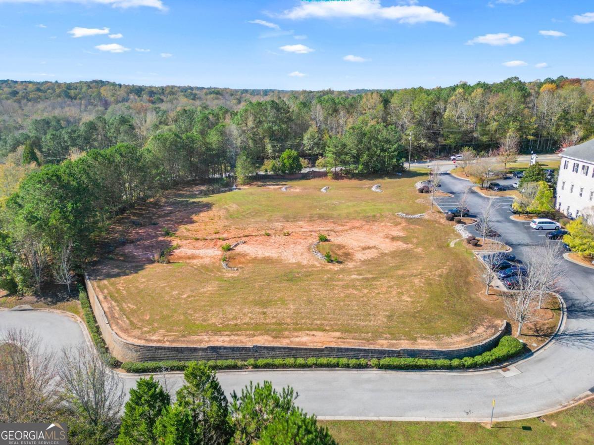 Make your mark in one of the fastest-growing corridors in the Atlanta Metro Area. This is your chance to own a 1.68-acre commercial gem right off busy Chapel Hill Road at 4500 Brookmont Pkwy and 4480 Brookmont Pkwy. These (2) parcels are surrounded by thriving businesses and offer excellent visibility in a high-traffic area. Whether you're looking to create a new retail hotspot or a bustling office complex, this site is a dream location for developers and investors alike.This level, graded, and development-ready parcel boasts zoning for General Commercial; perfect for: Retail shops, office spaces, a Medical center or Pharmacy, Banking institutions, or casual dining establishments Unmatched visibility comes with the property, featuring 267 feet of road frontage on Chapel Hill Road and 280 feet on Brookmont Parkway, offering prime exposure to over 36,000 vehicles daily (20,000 northbound, 16,000 southbound). Public water, sewer, and electricity are available (prospective buyers are encouraged to verify). DonCOt miss this opportunity to bring your vision to life in the heart of Douglasville! Schedule a tour today and see why this property is the perfect foundation for your next big project.