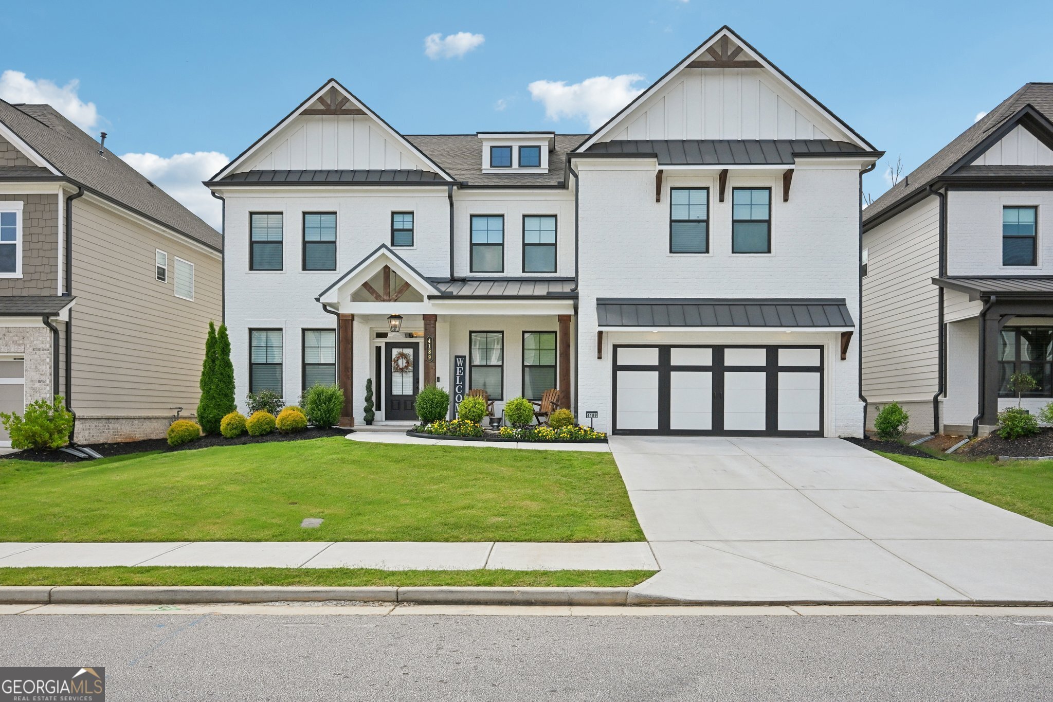 Immaculate, Award-Winning Builder-Owned Home Loaded with Upgrades! Located on a private lot that backs up to woods. This stunning, meticulously maintained home offers luxury, comfort, and thoughtful design at every turn. The main level features a private study with French doors and transom windows, a formal dining room with elegant custom trim, and EVP flooring throughout. The gourmet kitchen is a chef's dream-complete with an oversized island with granite countertops, a walk-in pantry, double ovens, a massive built-in refrigerator, and a convenient butler's pantry. The inviting family room boasts a striking cedar fireplace and flows into the spacious breakfast room with oversized windows that flood the space with natural light. Also includes a bedroom with a full bath on the main floor. A stained oak staircase leads to the upper level, where you'll find a luxurious owner's suite with a custom double tray ceiling. The spa-like ensuite bathroom includes a 7-foot walk-in tile shower with dual shower heads and a corner tile seat, and a massive walk-in closet featuring custom-built-ins and an oversized center island with drawers. Upstairs also offers a large loft-perfect for movie nights, game days, or a home office-plus generous secondary bedrooms. Step outside to enjoy a screened-in back porch, grilling pad, and custom brick bench-ideal for entertaining. This home features a painted brick exterior and is located in a top-rated school district with easy access to Parks, Shopping, Dining, and minutes away from I-85. A true showcase property that blends elegance and functionality!
