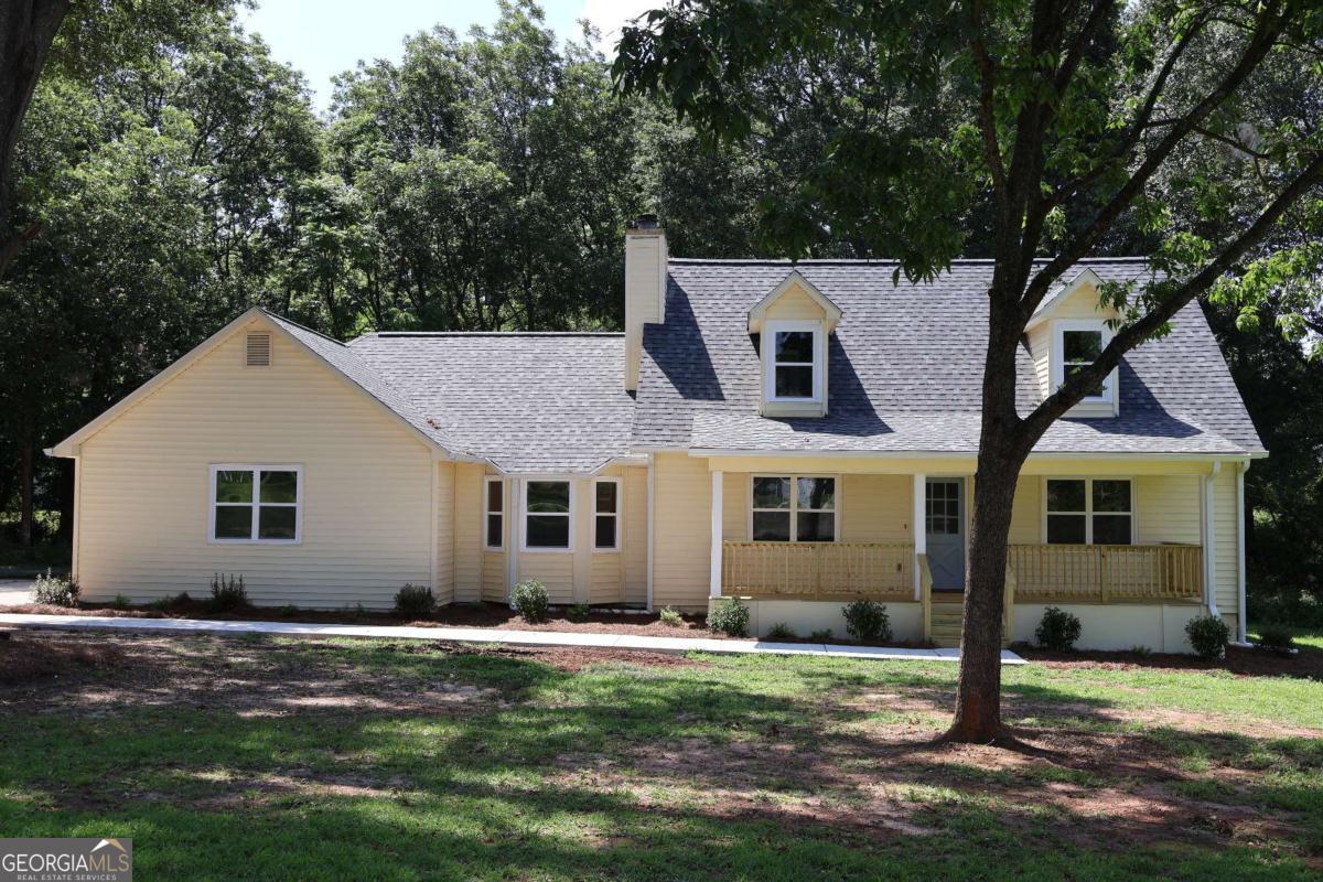 Freshly renovated two-story Cape-Cod with Owner's Suite on Main on a quiet Peachtree Farms cul-de-sac. Up to $10K in Down Payment Assistance! 2025 improvements include new roof, kitchen, bathrooms, dual HVACs, water heater, front porch, rear deck, lighting, and plumbing fixtures. Bright quartz kitchen with stainless range, microwave, and dishwasher opens to dining area and fireside family room. Owner's suite on the main level; two huge bedrooms and full bath upstairs. Refinished original hardwoods on the main floor, and new carpet upstairs. Level yard with new walkway and room to play or garden, plus plenty of driveway parking. No HOA rules to worry about. Just 5 min to East Clayton ES, Adamson MS, Reynolds Nature Preserve, and I-675 for an easy airport/Atlanta commute. Move in and enjoy the work that's already been done!Financing Incentives: Eligible buyers may qualify for up to $10,000 in Down Payment Assistance and 100% financing with no PMI.