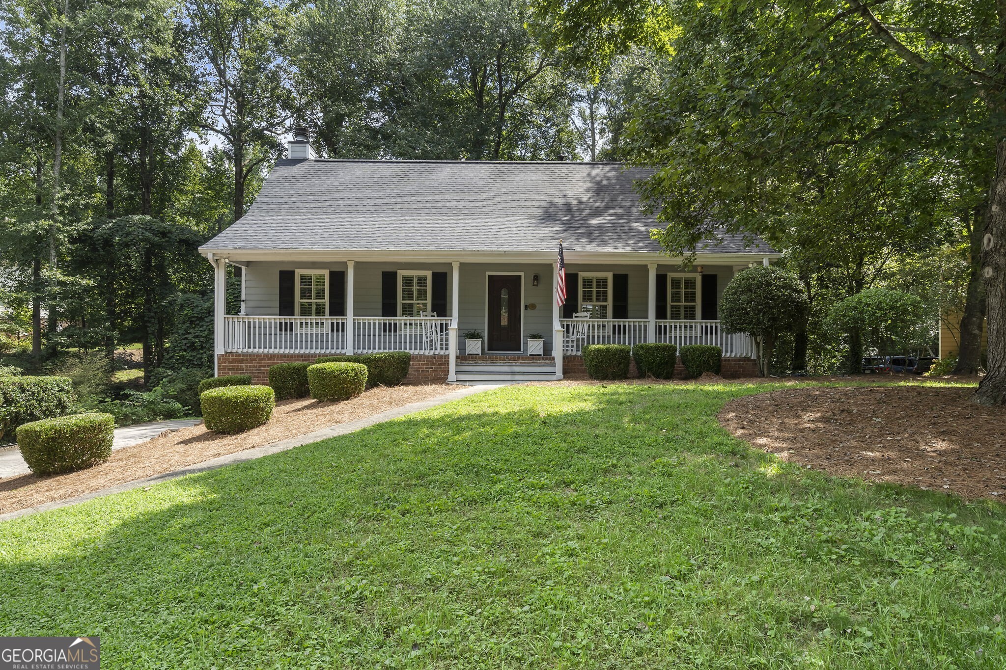 Charming home in sought after Heritage Farms Swim & Tennis Neighborhood in East Cobb! This home boasts a new roof, newer windows, new deck, and beautiful landscaping. Nestled on a tree lined, quiet street, you'll find the primary suite on the main with updated bath. Beautiful kitchen open to private backyard with brand new deck overlooking flat backyard perfect for morning coffee. Two secondary bedrooms up with shared bath. Finished basement with extra space perfect for office and two car garage. Plenty of storage and living space for comfortable living. Enjoy this inviting southern front porch and live your best life here!