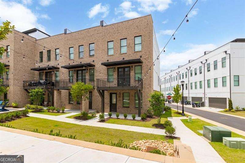 Be a part of a vibrant lifestyle right on the beltline in this stunning newer construction end unit townhome at Ten 29 West! This sleek 4 story modern townhome overlooks the central courtyard and boasts a fabulous private roof top terrace with skyline views. Ten 29 West is located directly on the new Westside trail extension of the beltline. Enjoy the expansive stretch of walking and biking trails of the beltline just beyond the residents secured access gate. The westside is booming with premier developments such as Echo Street west, Project Granite, and Westside paper. This location is unbeatable! Just imagine living life in the heart of west midtown close to hot attractions such as Westside motor lounge, Atlantic Station, Interlock, Mercedes Benz stadium, State farm area, Centennial Yard, World of Coca- Cola and so much more! Natural sunlight fills every room of this 3-bedroom 3.5 bath luxury town home. The home is well appointed with rich espresso hardwood floors, chic lighting, ceiling fans and one touch blinds throughout the living spaces. Entertaining friends will be a breeze with your large open living room and kitchen concept. Massive kitchen island with high end waterfall granite is the perfect spot to lay out the buffet! Stay organized with ample soft close cabinetry, pantry, and additional closet space. Dine al fresco on your second-floor deck just off the breakfast area. All bedrooms have a full bathroom attached making this the ideal roommate floor plan. All bathrooms are equipped with luxury tile, granite vanities, chic lighting and walk in closets. Brand new refrigerator, washer and dryer have been installed by the owner for your convenience. Don't miss the chance to become the new resident of this luxury lease opportunity in Ten29 West!