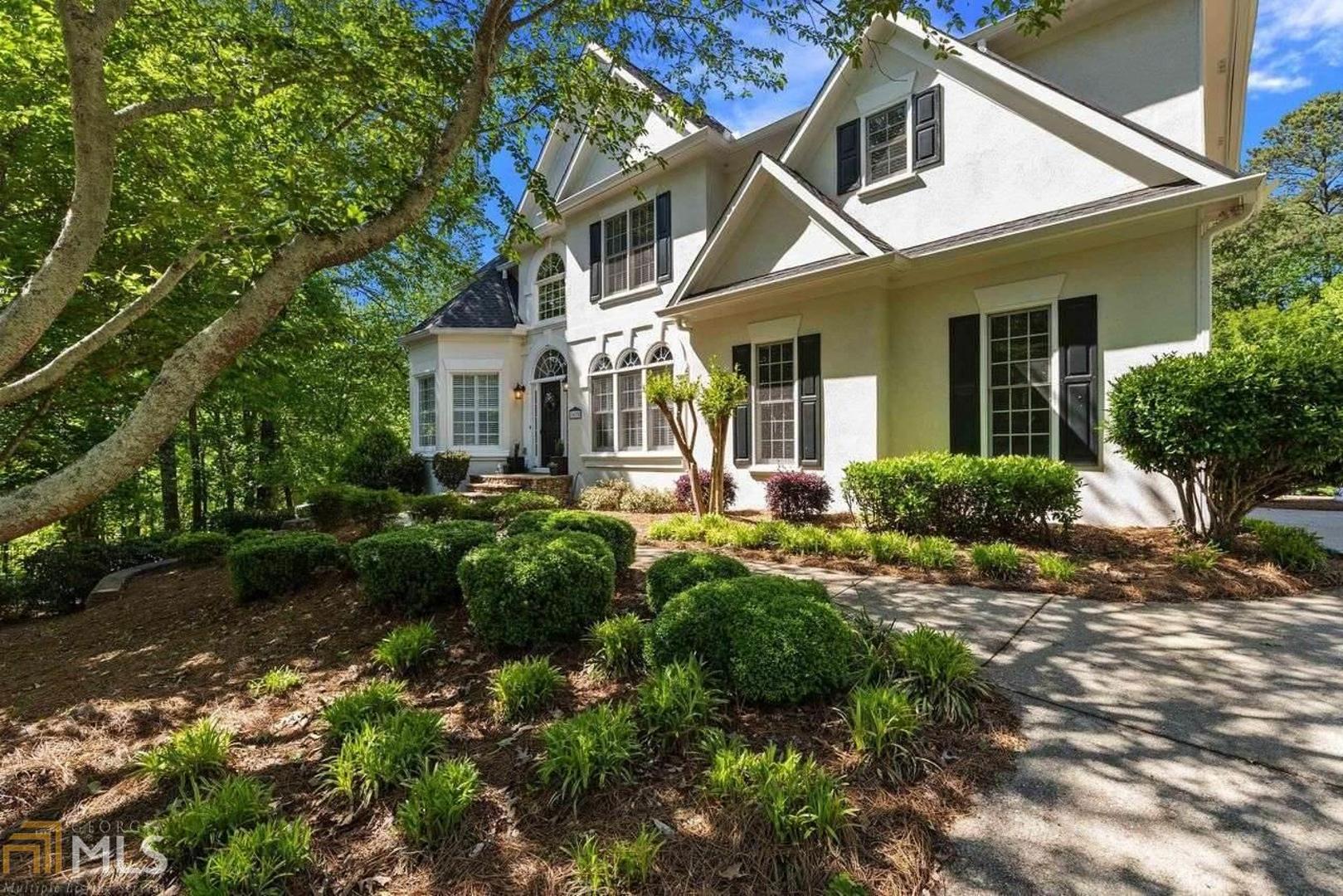 Immaculately maintained, spacious & bright home in sought-after Forsyth swim/tennis neighborhood! Open floor concept from 2-story great room w/built-in bookshelves looking into updated kitchen, with granite counters, hardwood floors, breakfast area! Vaulted ceiling & sitting area in spacious master with spa-like bath featuring whirlpool tub, updated light fixtures, walk-in shower, dual vanities, & generous walk-in closet!Two covered patios looking into the beautiful, lush landscape with private, flat backyard with sprinkler system. Large finished basement with private covered patio, kitchen/bar, full bath, exterior entrance perfect for teen or in-law suite. Lots of shade trees providing energy efficiency & privacy. Amenities-rich neighborhood includes a Jr. Olympic sized pool and bath house, 2 lighted tennis courts, b-ball court, kids playground, covered pavilion, community grills and fire pit. Prime location convenient to highly acclaimed Forsyth county schools and shopping areas!