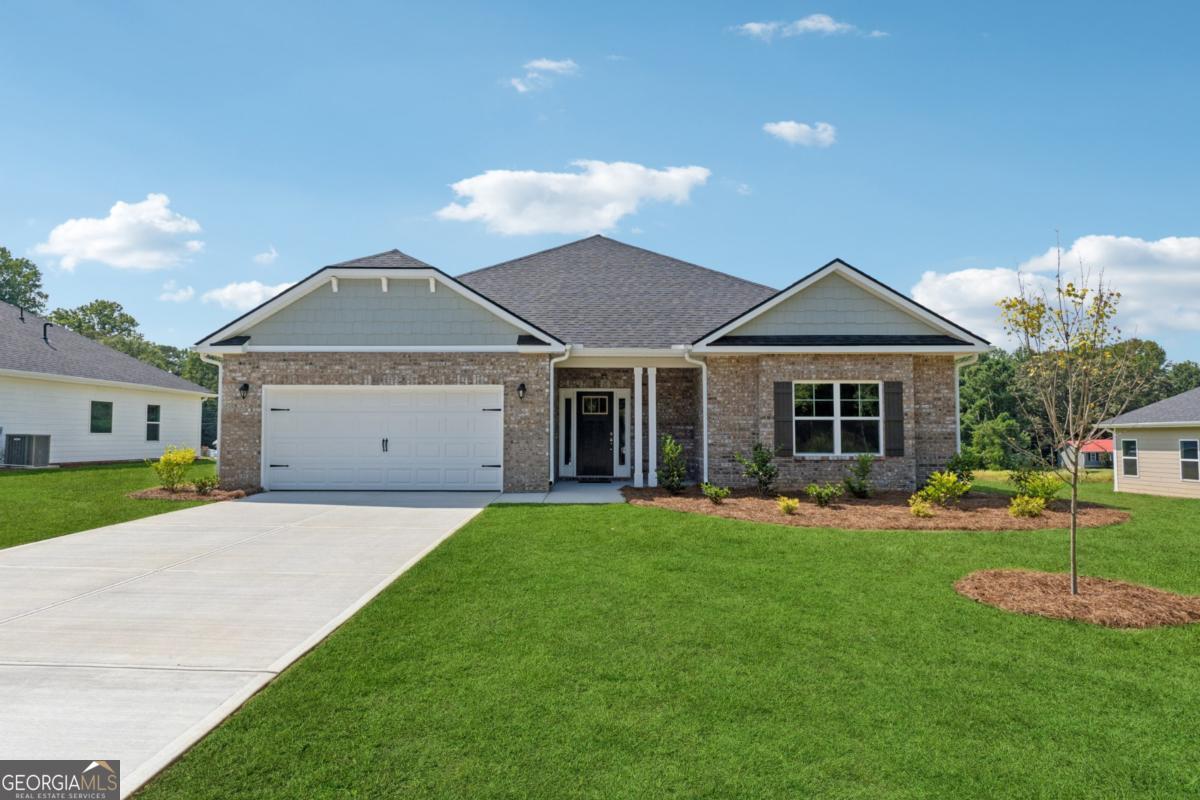 Welcome to this "Park Place Sanctuary" - A Classic and Cozy 4 Bedroom / 2 Bed - Ranch Retreat in the Park Place community! Envision waking up in your 1902 sq. ft. dream home in Park Place, affectionately known as "The Friendly City", Bowdon, GA. Designed to last and crafted with care, this home blends cozy nooks with open gathering spaces, inviting laughter, stories, and Sunday dinners. Natural light fills the walk-in foyer leading into the great open-concept family room, with a gorgeous granite countertop island awaiting your gourmet meal prep and a pantry just waiting to be filled. This beautiful split-bedroom layout offers 2 spacious secondary bedrooms and a full bath as you walk into the hallway. The amazing owner's suite has a luxurious soaking tub, a separate shower, and a walk-in closet. This thoughtfully designed space offers both privacy and connection, creating the perfect atmosphere for modern living. Home features 1 additional bedroom near the owner's suite, as it may be suitable for a nursery or study. Picture yourself unwinding on your covered lanai, overlooking a peaceful and spacious backyard for outdoor living and family barbeques. Whether hosting lively gatherings or enjoying a quiet evening, this home is designed to enhance every moment of your life. Built for quality and efficiency, "The Park Place Sanctuary" features architectural shingles for durability and two water heaters to ensure lasting comfort and peace of mind. you'll enjoy natural light throughout the day, making every room feel warm and inviting. Situated in Carroll County, minutes from I-20, local Bowdon schools, Tanner hospitals, and the University of West Georgia and West Georgia Technical College along Georgia State Routes 100 and 166, Bowdon combines small-town charm with convenient access to nearby communities, local downtown restaurants, and boutique shops. Near Carrollton Greenbelt walking trails, Little Tallapoosa, Hays Mills, and John Tanner Parks, great for outdoor life, hiking, biking, walking, boating, and fishing. USDA financing eligibility, and only $1,000 in earnest money required, making homeownership affordable and attainable. This is your opportunity to own a residence that perfectly blends style, efficiency, and affordability. Schedule your private tour today and start making memories in "Park Place Sanctuary."