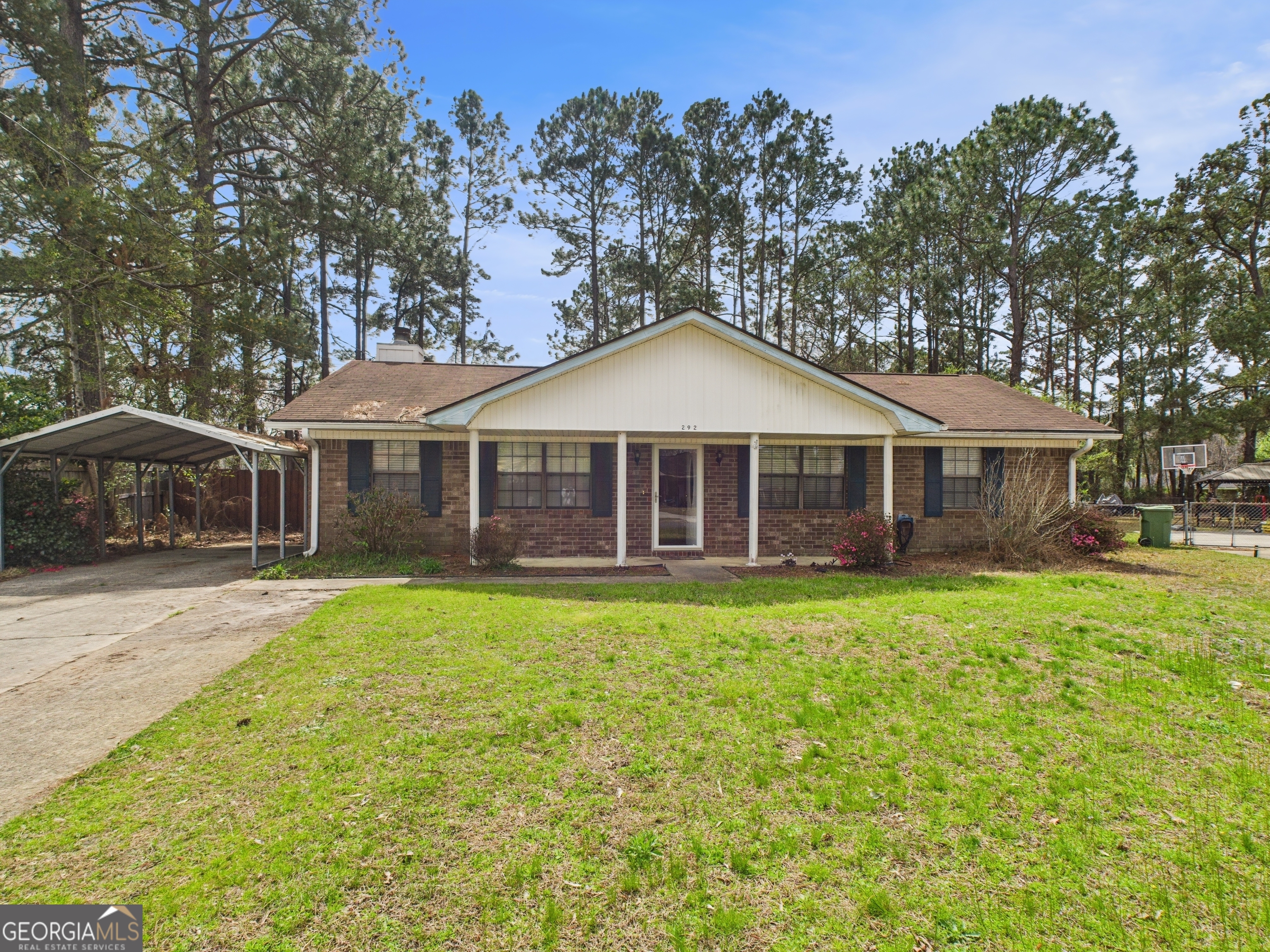 Come paint and decorate and call this your own! This delightful 3-bedroom, 2-bathroom brick ranch home offers comfort, style, and privacy in a wonderful Hinesville location! With wood floors throughout and tile in the kitchen, the home boasts a spacious living room with a cozy fireplace-perfect for family gatherings or relaxing nights in. Privacy fenced in backyard with screened in porch for relaxing without being pestered by insects. Both sheds stay with property offering ample storage for all your needs. Close to everything and no HOA!!! Schedule your showing today!