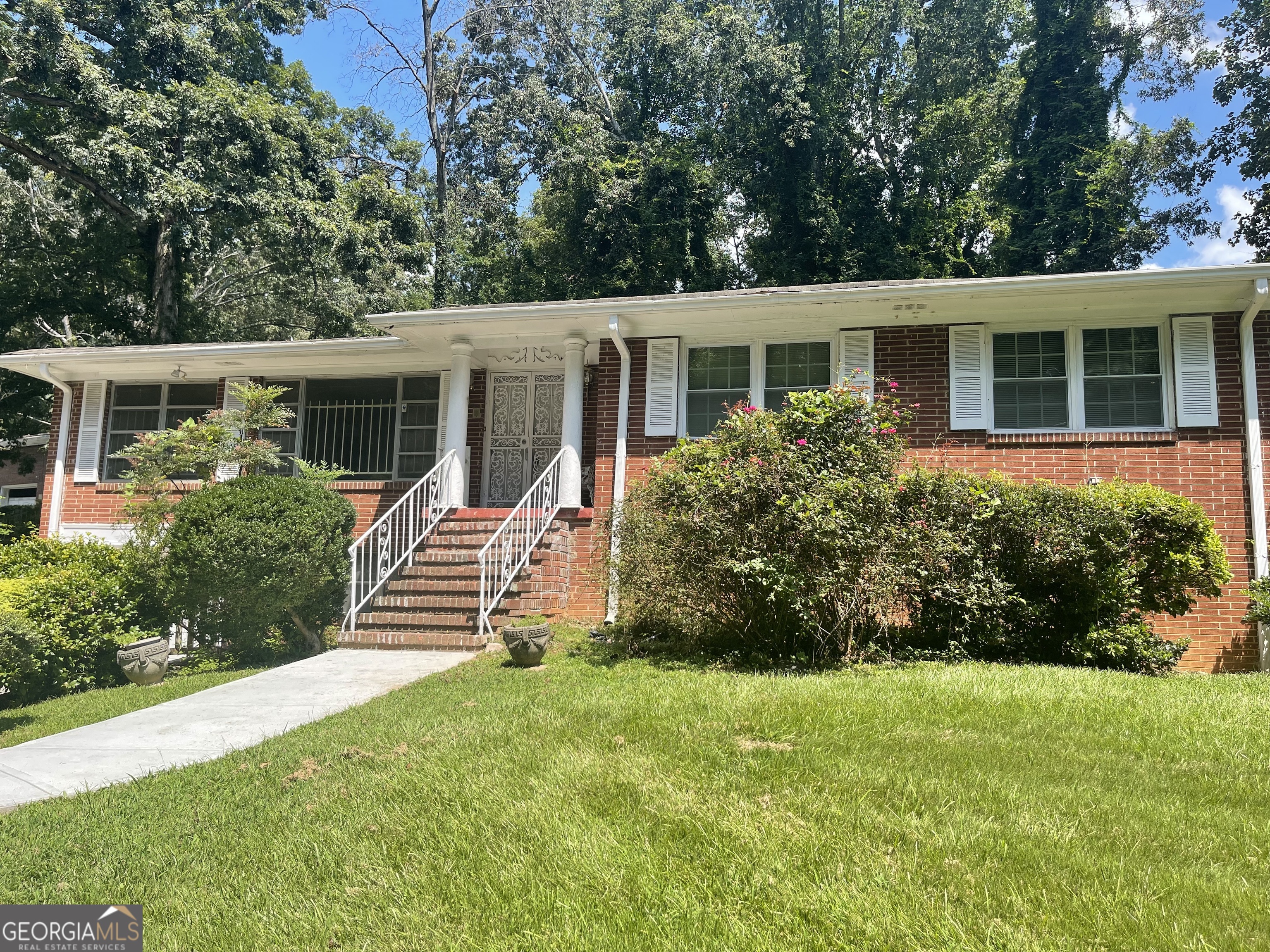 Great rental in Historic Collier Heights! Only Home Choice Voucher will be accepted. Spacious homes features 4 bedrooms, 3 full baths, finished full basement, 2 fireplaces, family room, living/dining room combination, garage/automatic opener, new carpet screen-in porch, patio, and newly painted. NO PETS! NO PETS!! Close to shopping, schools, park, interstate accessible and close to downtown Atlanta, and Cumberland Mall. Call owner for questions and showings - 404-4o8-4158.