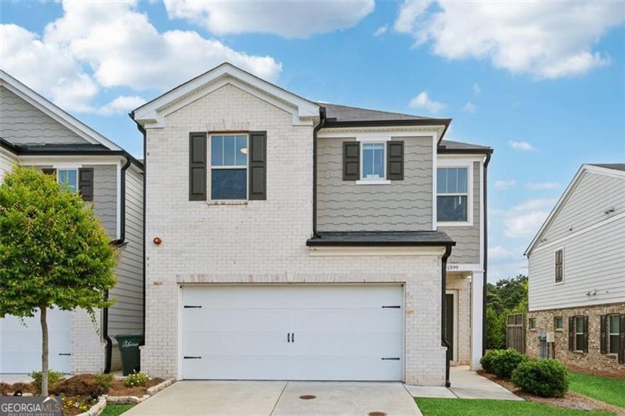 Welcome to 1399 Flathead River Lane, a meticulously maintained end-unit townhome nestled in the desirable Tramore Square community. This modern residence offers a harmonious blend of style, functionality, and convenience, making it the perfect place to call home. Open-Concept Living: The expansive main floor features a spacious great room that seamlessly flows into a chef's kitchen and dining area, ideal for both entertaining and everyday living. Chef's Kitchen: Equipped with luxurious quartz countertops, a central island, stainless steel appliances, stylish backsplash and a walk-in pantry, the kitchen is both functional and visually appealing. Versatile Loft Space: Upstairs, a versatile loft area awaits your personal touch - perfect for a home office, media room, or play area. Owner's Suite Retreat: The generously sized owner's suite boasts a luxurious ensuite bathroom with a walk-in closet, double vanity, a linen closet and a beautifully tiled shower. Two spacious secondary bedrooms provide ample closet space and share a full Jack and Jill bathroom. Throughout the home, you'll find LVP on the main floor, high quality and luxurious well-maintained carpet on the upper level and abundant natural light, enhancing the overall ambiance. Recently replaced the interior HVAC unit to ensure optimal comfort and system reliability. Outdoor Living: relax in your private patio with privacy screens on either side. Community Perks: Gated neighborhood with pet-friendly spaces, including a dedicated dog park. Convenient Location: Just 10 minutes from Marietta Square and KSU, 15 minutes to I-75, and 5 minutes to Tumlin Park-close to shopping, dining, and outdoor recreation.