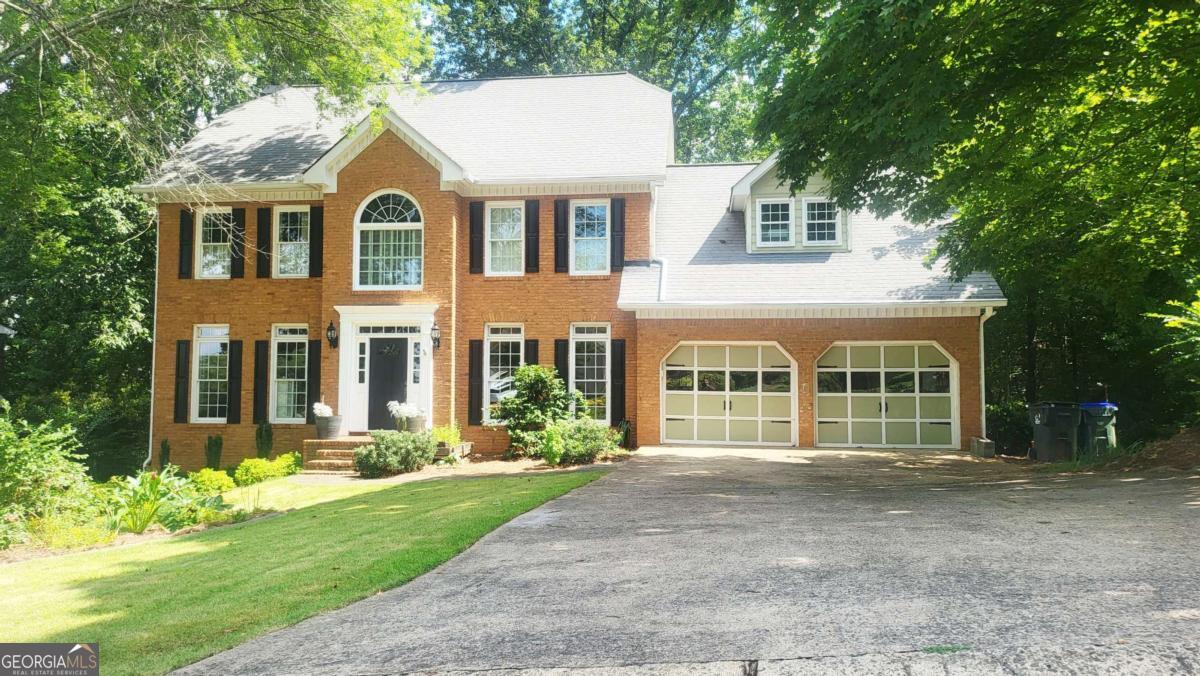 Priced for quick sale, bring your offers. Welcome to this spacious 5-bedroom, 4-bathroom home, spanning an impressive 3,827 sq ft, located in the highly sought-after Hampton Ridge Swim & Tennis Community. Nestled on a beautiful half-acre lot filled with mature trees, it is situated at the edge of Sweet Mountain Forest. This home is situated in the award-winning Lassiter High School District, ranked #6 out of 458 high schools in Georgia, offering both top-tier education and serene, private living. Step inside to discover: five oversized bedrooms, perfect for families of all sizes; four bathrooms for optimal convenience; a separate-entry in-law suite, ideal for guests, multigenerational living, or even rental income; spacious living areas with natural light, a custom-built marble fireplace, and breathtaking forest and mountain views. Enjoy peaceful outdoor living in a wooded setting with plenty of room to entertain or relax in your private, tree-lined backyard. Additional features include: Two AC units for maximum efficiency climate control. A $ 10,000 outdoor jacuzzi hot tub spa will stay with the property, $4K smart touchscreen refrigerator as well. Smart recessed lights and smart AC control. Access to Hampton Ridge's premier amenities, including a swimming pool, tennis courts, and more. Located on a quiet, established street with a true community feel Close to parks, shopping, and dining while still offering a secluded, nature-rich atmosphere. This one-of-a-kind property blends privacy, space, and a prime East Cobb location. Homes like this don't come up often-schedule your private tour today! The home is occupied. Please use the shoe covers provided.