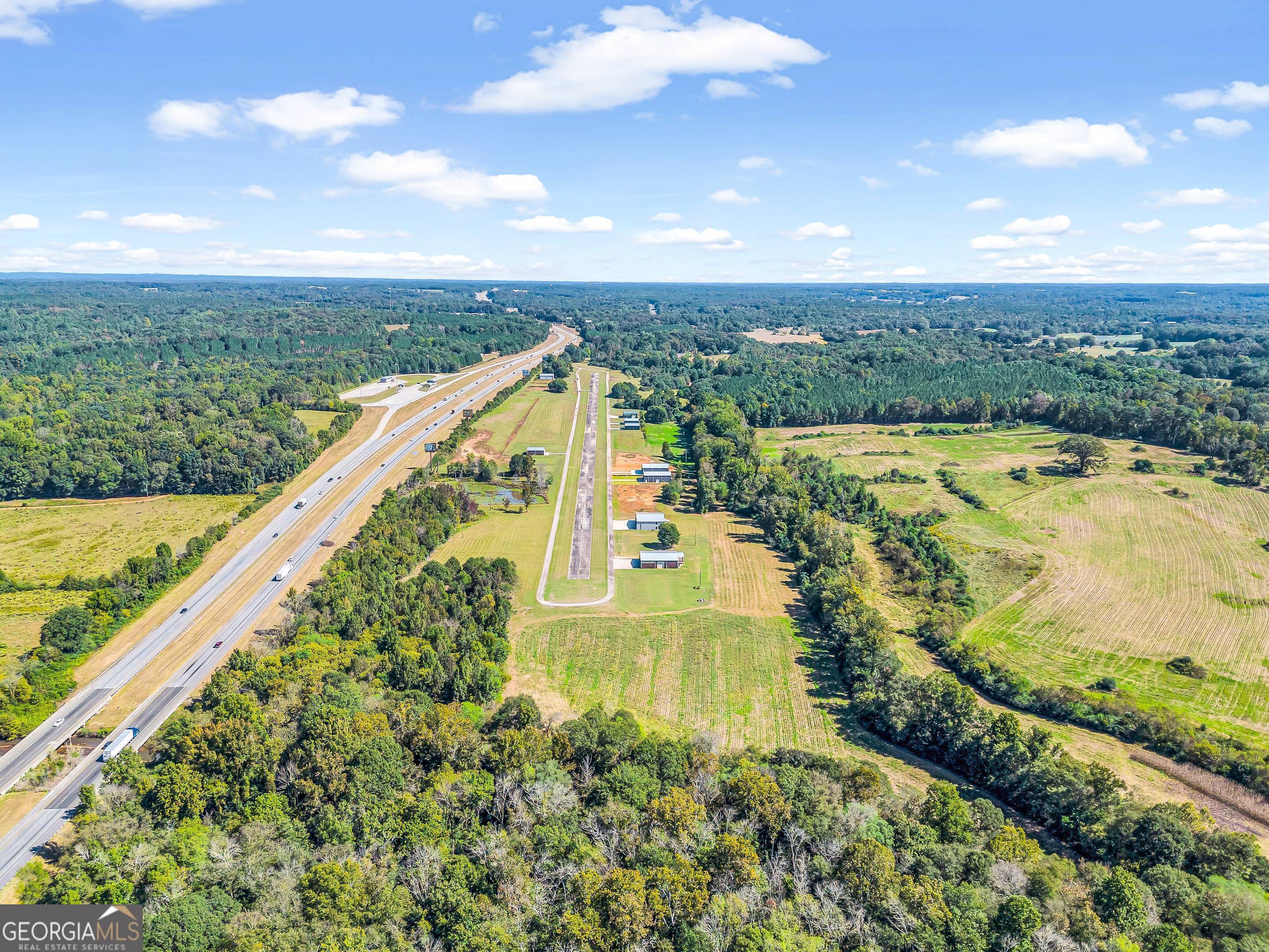 Beautiful 68+ acre airpark in Northeast Georgia. Established in 2006, this private airpark with 90 lots is parallel to I-85 in Franklin County. It's located about 5 miles South of Lavonia and is convenient to Hartwell, Lake Hartwell, Commerce and Anderson. The property is zoned LI and is centered around a 3,000 ft x 50 ft concrete runway with great approaches including a grass landing strip. Amenities include a wooded walking trail and fishing pond. There are currently several hangars for sale. Two hangar homes with unique living spaces are available as well as empty hangars and one with an option for office space and bathroom. Sale includes leases on several hangar lots in place.