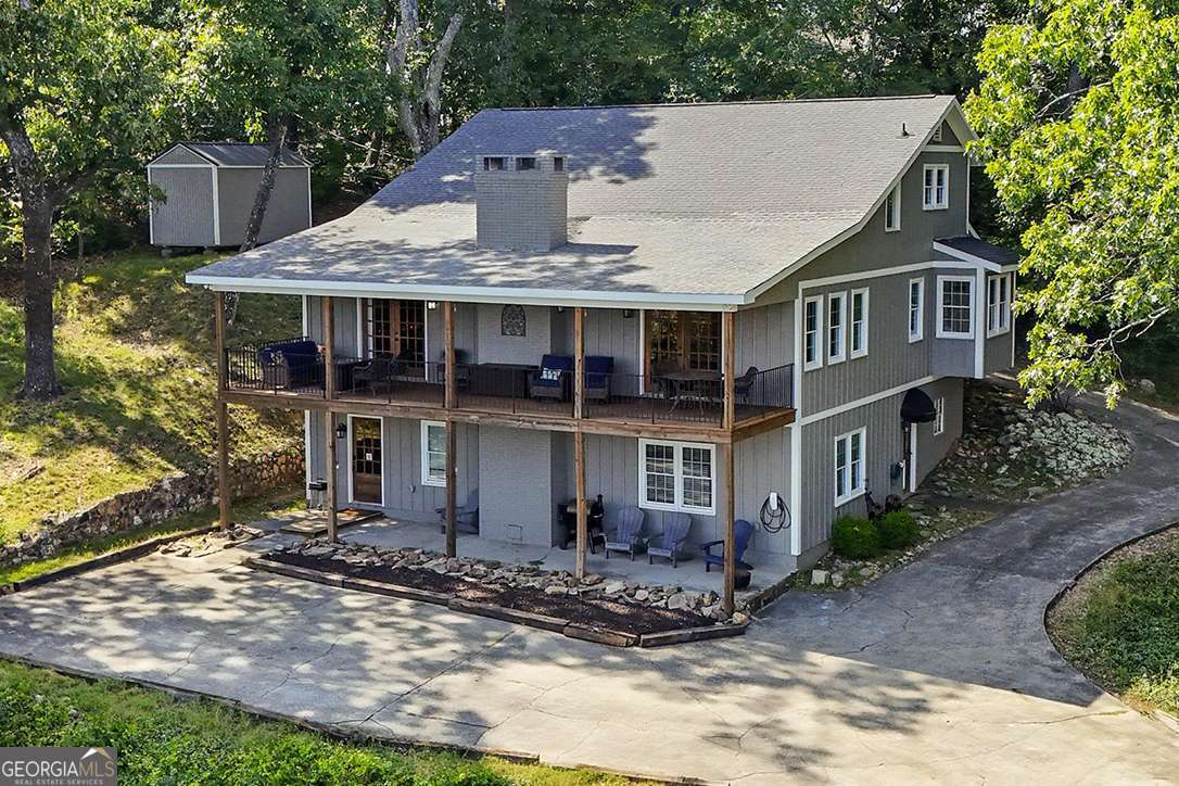 Beautiful 4-bedroom, 3.5-bath home on Mount Alto with breathtaking mountain views! This versatile property offers the perfect fit as a primary residence, vacation retreat, or income-producing rental. The main level welcomes you with wood planked vaulted ceilings accented by rustic beams, a stone fireplace, and an updated kitchen featuring solid-surface countertops, stainless steel appliances, and a farmhouse sink. From the kitchen and living room, soak in sweeping mountain views, or step out onto the covered deck to fully enjoy the scenery. The owner's suite with a full bath is conveniently located on the main level, along with a half bath and laundry. Upstairs offers two spacious bedrooms and a full bath, while the fully finished basement provides a second living area, bedroom, and full bath with outdoor access. The lower-level covered patio also opens to gorgeous mountain views, giving you a serene backdrop from every level of the home. With two covered outdoor living spaces and panoramic views throughout, this home captures the best of mountain living right in Rome. Don't miss this unique opportunity-schedule your private showing today!