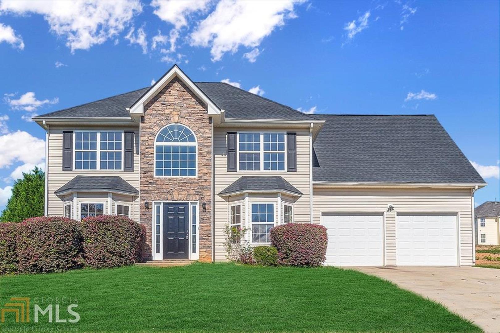 Large two story home in Snellville with a great corner lot. Spacious homesites in the community. Formal living & dining rooms. Laminate style flooring throughout including bedrooms upstairs. Huge master w/sitting room & his/her closets. Fireside family room. Kitchen w/ lots of cabinets. No rentals allowed in community. Brand new roof.