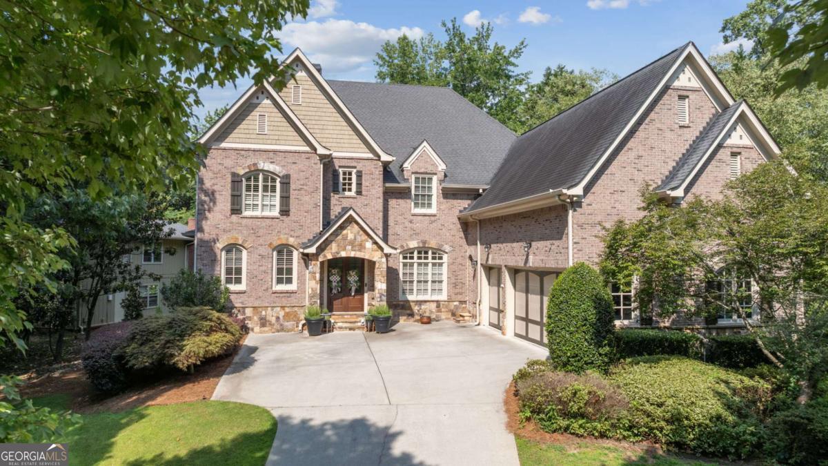 Welcome to 3283 Stratfield Drive - a stunning custom-built John Willis home nestled in the heart of Brookhaven's highly sought-after Cambridge Park. This elegant residence offers over 6,800+ square feet of thoughtfully designed living space, featuring 7 bedrooms, 6.5 baths, and a rare 3-car garage. Step inside to an expansive foyer flanked by a formal dining room and sitting room or private office. The light-filled main level features a fireside living room with custom built-ins, flowing seamlessly into a chef's kitchen complete with stone countertops, Wolf & Subzero appliances, walk-in pantry, and a large breakfast bar. A guest suite with full bath and a spacious screened-in porch with a fireplace overlooking the beautifully landscaped backyard & pool round out the main floor. Upstairs, the oversized primary suite offers a spa-like bathroom with double vanities, soaking tub, separate shower, and a generous walk-in closet. Three additional bedrooms and a large laundry room complete the upper level. The fully finished terrace level includes a complete in-law suite with a second full kitchen, living room, two bedrooms, two baths, a second laundry room, and its own private driveway and entrance - perfect for extended family, guests, or rental income. Cambridge Park includes access to Brookhaven's hidden gem, Silver Lake, and walking trails leading to Brittany Swim & Tennis Club. There is an optional HOA here for Cambridge Park, the home is in a core neighborhood for the Brittany Club, and that is a private club/membership you would have the ability to join. Just minutes from Brookhaven Village, enjoy walkable access to the Dresden corridor's vibrant shops, cafes, and top-rated restaurants like The Ashford, Valenza, and Verde. You're also a quick drive to Downtown Chamblee, filled with local breweries, creative dining spots, and the Chamblee Rail Trail. With close proximity to Montgomery Elementary, Chamblee Middle & High, and prestigious private schools including OLA, Marist, and St. Martin's, this home offers the perfect blend of luxury, lifestyle, and location.
