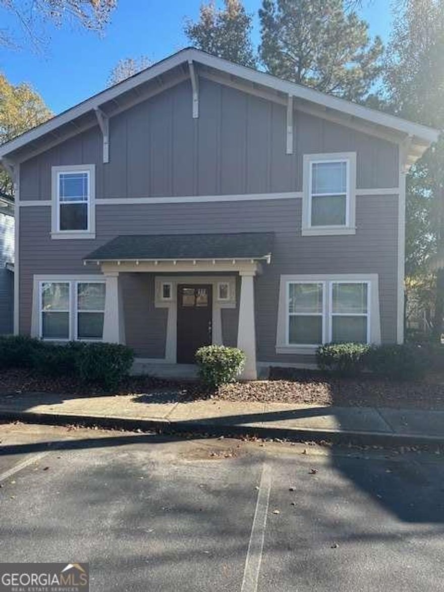 Rare opportunity for cottage listings.   This is the Redwood Plan with 2 BR/2.5 Baths.  You own a vertical half of the building. No one living above or below you. Currently rented through July, 2026, at 1650/month and professionally managed. Buy now and have August, 2026, occupancy with income until then.  Main level features LVP flooring, 1/2 bath, nice kitchen and laundry closet.   Upstairs had 2 Bedrooms w/ private baths and carpet has been replaced.  Woodlands of Athens is a gated community with resort style amenities to include clubhouse with fitness center and gathering areas, huge pool, tennis/basketball/volleyball courts.  Woodlands does not allow nightly/weekly rentals.