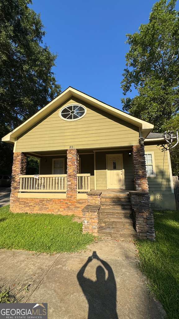 Incredible Real Estate Opportunity! This property is a true power play: a front duplex, each unit featuring 3 bedrooms and 2 bathrooms, with a finished attic offering additional space-potential for up to 5 bedrooms and 3 baths in total. The rear building includes a 3-bedroom, 1-bath apartment above a 2-car garage (garage doors have been closed off). Perfect for owner-occupants looking to live in one unit and rent the others, or for investors seeking multiple income streams. So much potential with plenty of extra space to explore-this property is full of possibilities! Schedule showings through Show & Assist. Listing agent will follow up directly.
