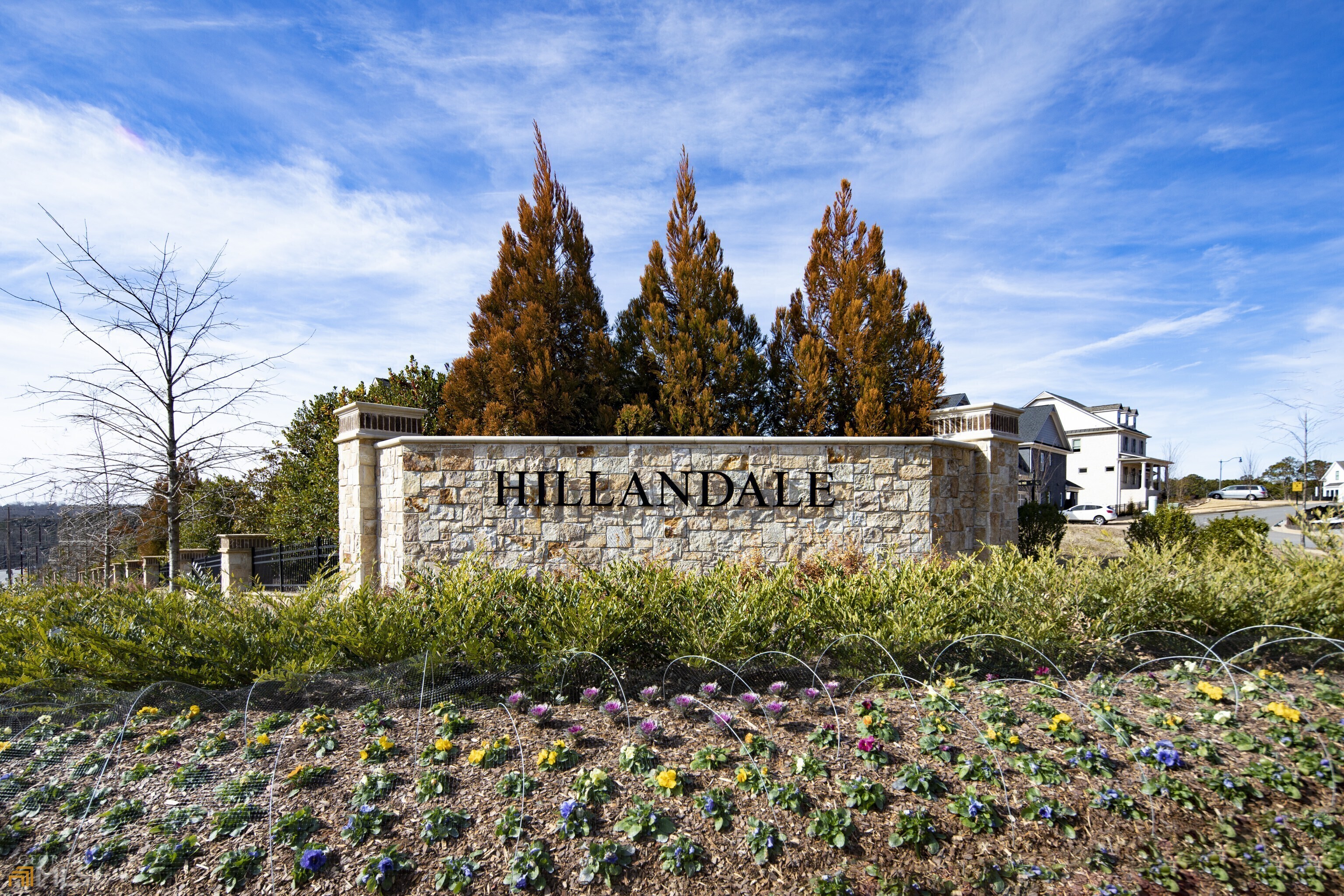 Hillandale is a Patrick Malloy Community, a luxury community in historic Roswell. The Hillandale model offers a guest suite with full bath on the main level, 4 bedrooms, 3 baths upstairs. This home has all the bells and whistles. Two kitchen islands with waterfall countertops, steam bar, coffee bar, upgraded Wolf appliances, abundance of hardwood flooring, hardwood stairs. It has a 3 car tandem garage. The best view of the sunset can be seen from the perfect cul-de-sac location. Entertaining is a breeze with two covered decks. The rear and front yard is maintained by the HOA. Walking distance to downtown Canton street and shopping.