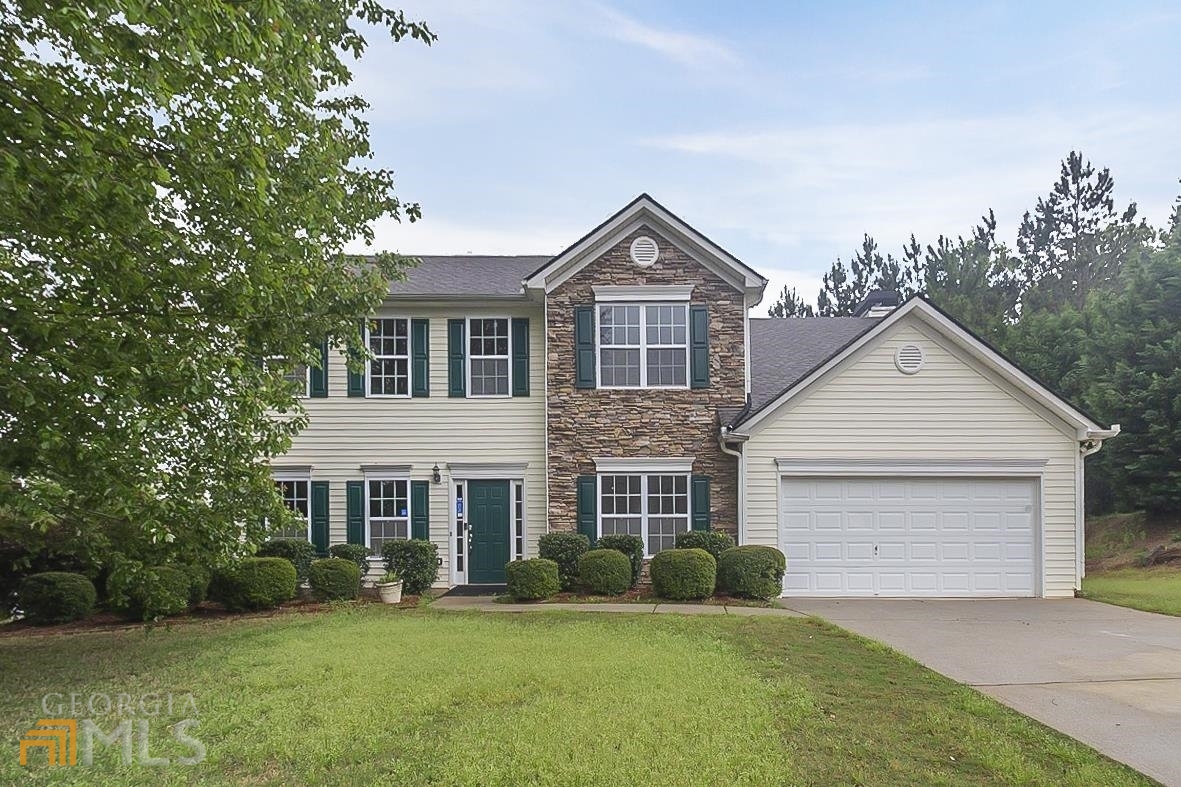 This Dallas two-story corner home offers a two-car garage.