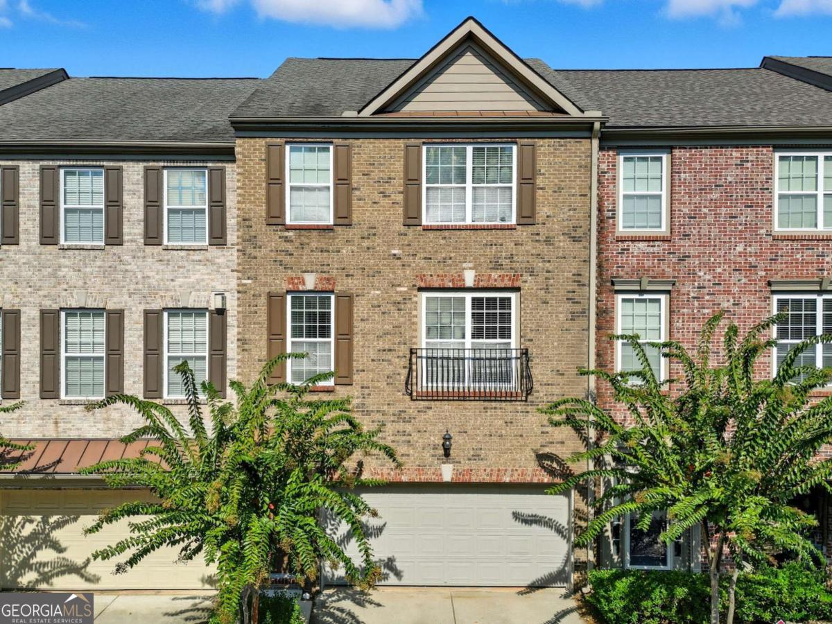 Beautifully maintained townhouse with an open-concept floor plan, hardwood floors, cozy fireplace, and a chef's kitchen featuring granite countertops, stainless steel appliances, and a gas stove. Step onto the private deck for outdoor entertaining. Upstairs, the owner's suite boasts a tray ceiling, spa-like bath with soaking tub, separate shower, dual vanity, and walk-in closet. The guest suite has vaulted ceilings, its own full bath, and a large walk-in closet. The terrace level offers a third bedroom/bonus room with full bath, plus garage and exterior entry-perfect for media, office, or guest use. Updates include hardwoods, new carpet, new LVP flooring, fresh paint. Two-car garage and excellent location near Peachtree Parkway, Peachtree Industrial Blvd, The Forum Shops, and dining. Move-in ready and in great condition-don't miss this one! The leasing cap is set at 30 units and has not yet been reached. For your investment, please note that the buyer is responsible for contacting and confirming the exact number of units still available.