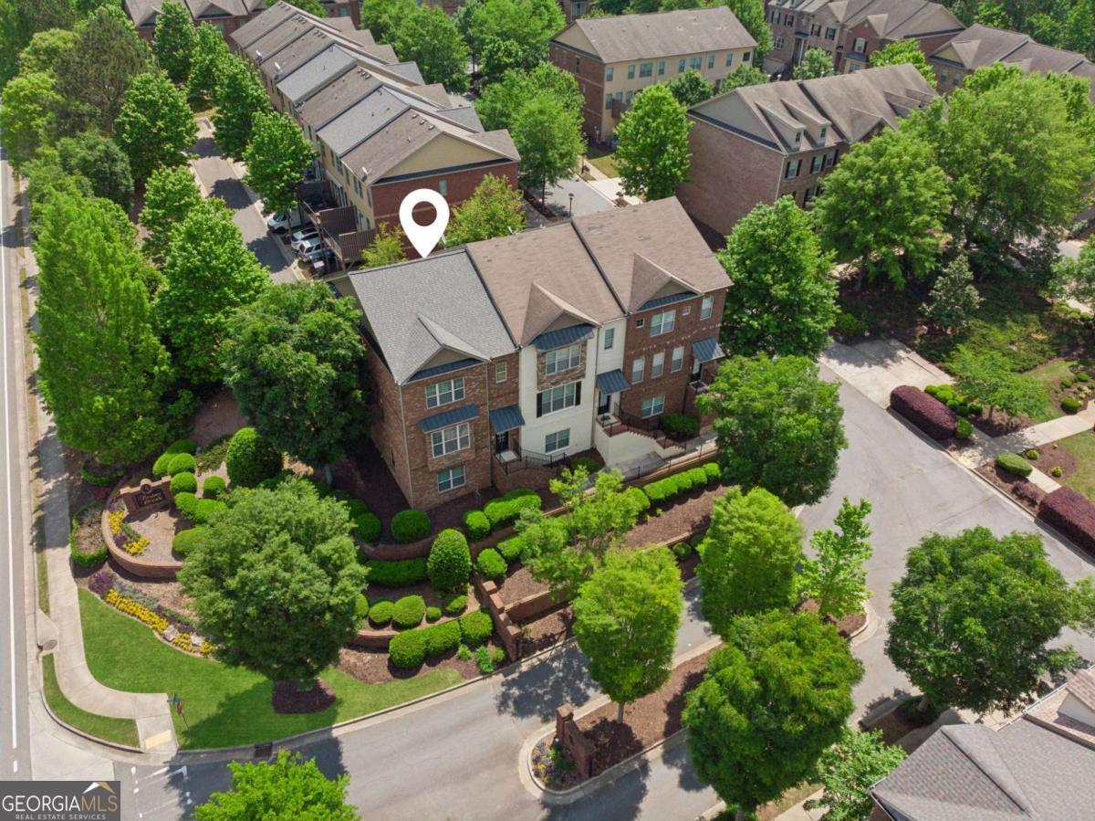 City Style Meets Suburban Convenience in This Sunlit End-Unit Townhome in Timber Creek! Welcome to your bright and beautiful retreat, perfectly positioned on a coveted end unit in the desirable Timber Creek community. Overflowing with natural light from three sides and offering added privacy, this home combines modern luxury with everyday comfort-all in a location that's second to none. Just minutes from GA 400, the MARTA Park & Ride, North Point Mall, the Big Creek Greenway, and an abundance of dining and entertainment, you'll love how easily city access meets peaceful suburban living. Step inside to discover designer touches and thoughtful upgrades throughout, including gleaming engineered hardwood floors, elegant crown molding, custom built-ins, and stainless steel appliances. The open-concept main level is made for gathering, with a chef's kitchen featuring an oversized island, walk-in pantry, and a sunlit breakfast nook that flows seamlessly into the fireside great room. Fresh NEW CARPET enhances the light, airy feel of the home, while walls of windows bring the outside in. Upstairs, your serene owner's suite boasts two generous walk-in closets and a spacious en-suite bath-offering a true private escape. Unwind on your private deck with a cup of morning coffee or relax after a long day. Downstairs, a versatile terrace-level flex space is ideal as a guest suite, home office, or rental opportunity. Additional features include: Brand NEW Roof-Two-Car Garage-Extra Parking Just Steps Away-Quiet, Welcoming Community If you've been searching for a home that blends lifestyle, luxury, and location-this is the one. Schedule your showing today and experience everything Timber Creek has to offer!