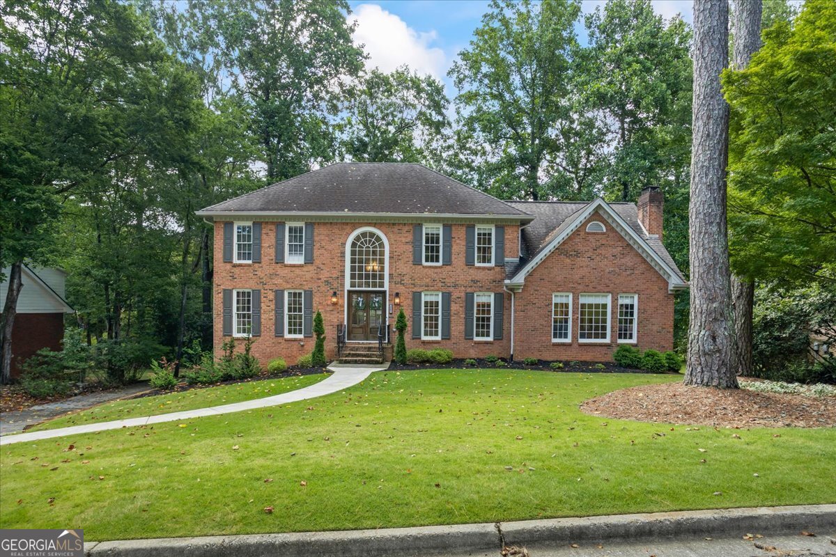 Welcome home to sought after River Station neighborhood in Peachtree Corners. This renovated 5 bedroom, 4 bath home doesn't spare any details. The foyer is welcoming with a designated office space to your left, an warm living space complete with fireplace and built in floor to ceiling book cases. This entertainers dream kitchen has SS appliances, gas range, quartz countertops and more! You don't want to miss the coffee bar and butler's pantry. Off the kitchen you'll find an adorning sun room leading to the expansive back porch overlooking the private back yard. On the upper level, you'll find three bedrooms and two full baths. The master bedroom boasts ample space with a reading nook. The bathroom shower is a must-see and is equipped with three shower heads and soaking tub, oversized walk in closet with custom closet system! The full daylight basement has been finished with elegant touches to the in-law suite. With a secondary kitchen, bedroom, bath room, living space and sun room, you'll want for nothing! Swim & tennis community with river access & more! Call Catrina for more information or to schedule your private showing. (470)595-0860
