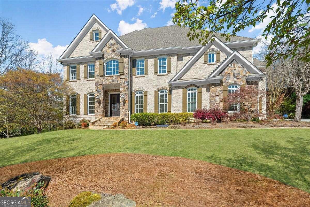 EXCEPTIONAL HOME AT AN EXCEPTIONAL PRICE! Welcome Home to this Stunning, Custom Built, 4-sided Brick Executive Estate in one of East Cobb's Finest Gated Communities - an INCREDIBLE opportunity in Rivers Call!  From the moment you enter the light filled Two-Story Foyer you will love the exquisite finishes and beautiful Updates.  Features include Exceptional Curb Appeal, a  Newly Renovated Chef's Kitchen, Banquet Sized Dining Room, Multiple Living Spaces, Bedroom on Main, Indoor/Outdoor Living, Five Fireplaces, enormous Custom-Built Bar on the Terrace Level AND the convenient Elevator for all three levels of living!  Live the life you deserve in this luxurious and inviting home, exquisitely crafted by Custom Builder John Willis - named Builder of the Year by the Greater Atlanta Home Builders Association!  High end finishes include the magnificent Fireside Great Room with a Coffered Ceiling and French Doors  that open to the serene and spacious Screened Porch that spans the length of the house, overlooking your lovely back yard, perfect for Dining Al Fresco AND Outdoor Living.  Plenty of room for Cooks, family AND guests in your bright, open Kitchen with new Quartz Counters, Herringbone Tile Backsplash, a Fireside Keeping Room/Breakfast Room area and a convenient Bar open to the Great Room.  Enjoy MULTIPLE spaces to work, study and play, including a Private Office on the Main level and a massive Living Room/Media Room UPSTAIRS. There is a getaway space for EVERYONE in this dream home!   Start and end each day in the enormous Owner's Suite, complete with a Fireside Sitting Area, Spa-Like Bath and FANTASTIC, Walk-In Closet. Entertain with ease on EVERY LEVEL in the elegant open flow, including the Terrace Level Bar - perfect for hosting parties or cheering the team on Game Days. The driveway features a convenient, wide parking pad, for plenty of guest parking, and the extra Office on the Main Level can easily be converted back to a 3rd Car Garage.  Enjoy a swim, host a Pool Party or just relax in the elegant, private surroundings of the Rivers Call community pool. Immerse yourself in nature in the glorious Chattahoochee River Nature Trails, just steps away.  Enjoy quick access to Buckhead, Midtown, Sandy Springs, East Cobb, Roswell and The Atlanta Braves Games at Truist Park/The Battery.  Rivers Call is known for friendly neighbors and fun community events, ideally located beside the incredible Chattahoochee National Preserve. Life can strike a balance in this exquisite home. You've earned it!