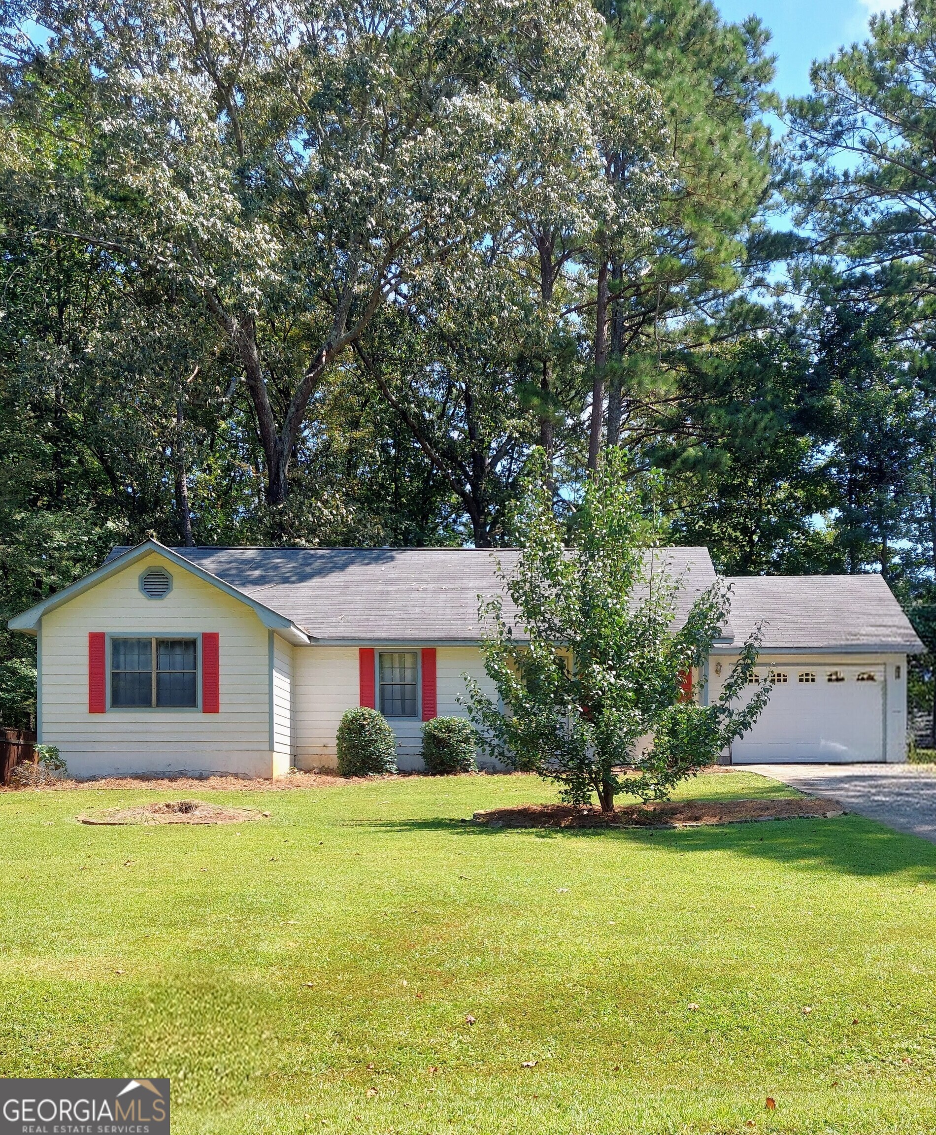 This cozy 3-bedroom, 2-bath Ranch Style Home is move in ready, wonderfully priced and full of charm! The adorable rocking chair front porch is great for relaxation and enjoying the peaceful setting of this quiet, nestled community. The back yard is partially fenced for more privacy with a mid-sized shed awaiting to take in all of your hide-away items. Inside you're greeted with updated LVP flooring, sizable ceiling fans and a spacious primary suite with an en suite bath. The 2nd bedroom has capacity for a queen sized bedroom suit, the 3rd bedroom is perfectly sized for a guest bedroom, office or comfortable reading room. Enjoy the warmth of a brand new gas water heater, the convenience of the secondary bathroom, laundry room, utility room and the efficiency of the galley styled kitchen with dishwasher and pantry. This cutie is sitting on a leveled, partially wooded lot with a side area carved just right for gardening. It also has a newer roof, security system and a well maintained HVAC system. The 1-car garage and additional parking pad will make parking suitable for you and your guests. Home Sweet Home is nicely tucked, yet super close to shopping, banking, restaurants, parks, library, entertainment and minutes away to I-675 and I-75. Its the ideal location promising future value and growth with new developments in nearby areas! Whether you're downsizing or just getting started, 246 Old Atlanta Road in Stockbridge is ready to provide... Charm, Convenience and Comfort! Make it yours with an offer today. Additional photos are on the way!