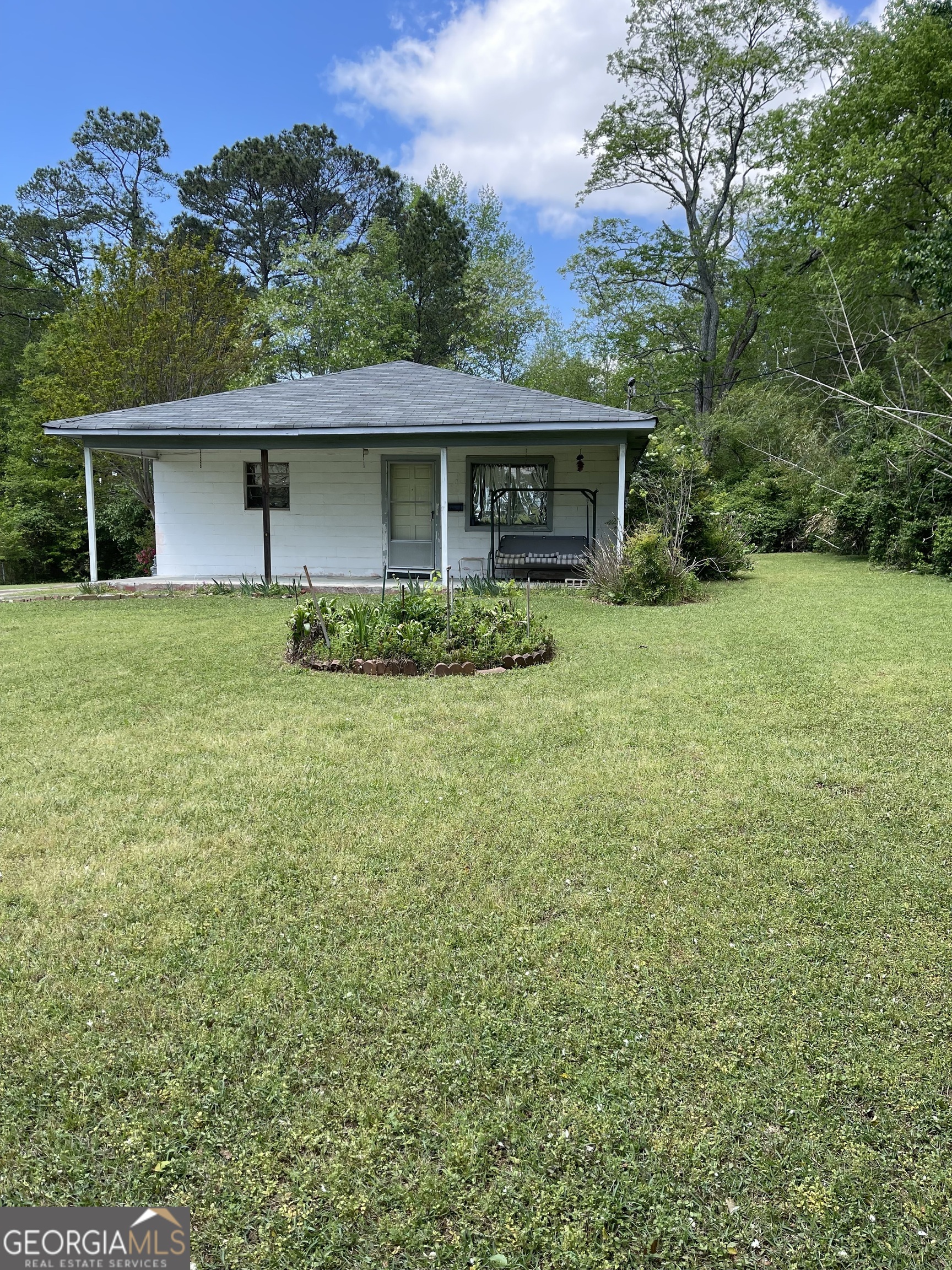 This property is perfect for an assemblage with lot next door (app. 1 acre). The block home on subject property should be a tear down. No sellers disclosure statement is available as the POA has never occupied the the subject property. Land has potential for commercial use.