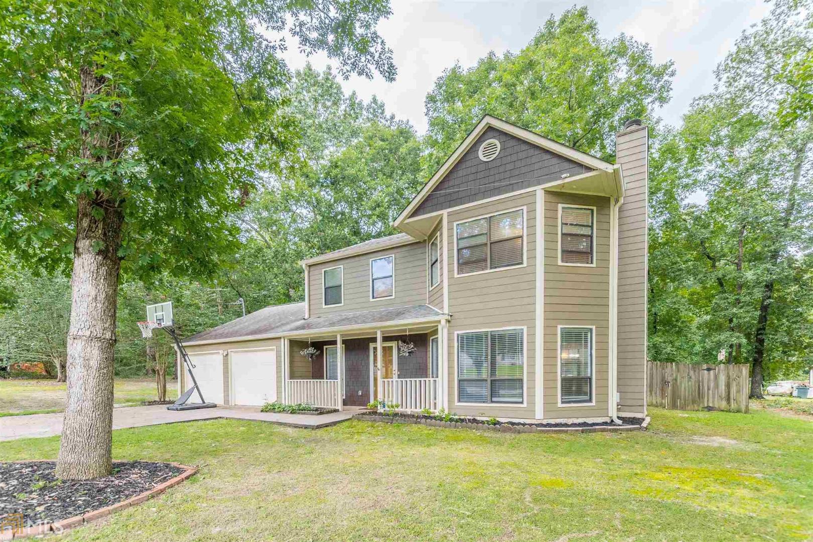 Charming Two-Story on Rare 1+ Acre of Land! This Adorable Corner-Lot Home Features New Counter tops + Cabinets + Flooring in the Kitchen, New Paint Throughout, New Flooring in the Bathrooms, Fenced in Back Yard, Large Master Upstairs With Soaking Tub, and so Much More That You Don't Want to Miss. Located in the Award-Winning Gwinnett County School District and Just Minutes From Down Town Lawrenceville!