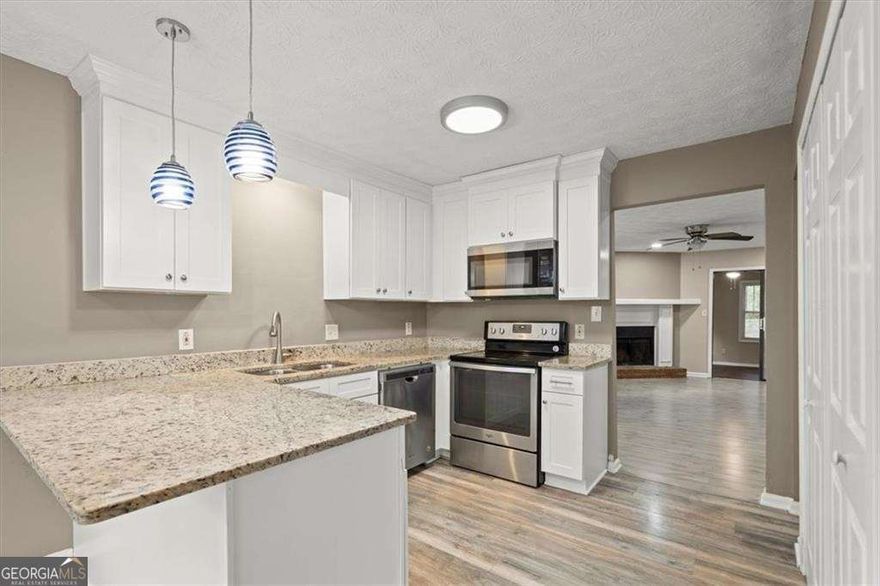 This inviting 1,338 sq. ft. townhome offers comfort, convenience, and plenty of charm. The open floor plan features a bright living room with a cozy fireplace, perfect for relaxing or hosting. The kitchen includes generous counter space, ample cabinetry, and a designated dining area for everyday meals or entertaining.    Both bedrooms are well-sized retreats. The primary suite offers a private bath and a large closet, while the secondary bedroom is perfect for family, guests, or a home office. Throughout the home you'll find easy-to-maintain flooring, abundant natural light, and thoughtful storage.    Step outside to a fenced backyard ideal for enjoying quiet mornings, grilling out, or letting pets play safely. This home also includes in-unit laundry hookups, central heating and cooling, and plenty of storage options.    Location is everything, and this home delivers. Just 3 miles from Downtown Woodstock, you'll be minutes from award-winning restaurants, boutique shopping, live music at the amphitheater, and year-round community events. Whether it's a Saturday stroll through the farmers market or dinner and a concert, all of Woodstock's charm is practically at your doorstep. Quick access to I-575 makes commuting a breeze, while the property is zoned to highly rated Cherokee County schools.    Flexible Lease Terms - 6mos/12mos/18mos/24mos - Pets considered with approval. No smoking. Tenant responsible for some utilities.