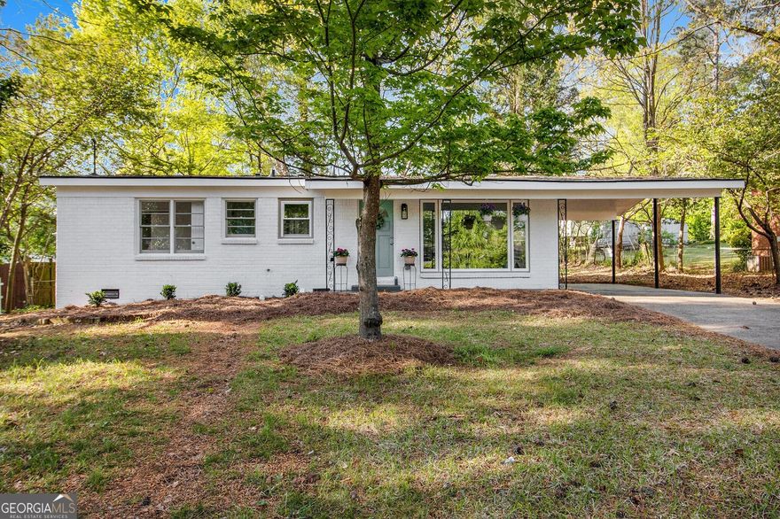 Fully Renovated Brick Ranch in an unbeatable Marietta location! Just minutes from Marietta Square, The Battery, Vinings, Shopping, Dining, Entertainment, and with Easy Highway Access, this home puts you in the heart of it all. Step inside to discover a Flowing Floor Plan featuring Refinished Original Hardwood Floors and a Light-Filled Family Room with a Large Picture Window. The Eat-In Kitchen boasts White Shaker Cabinets, Granite Counters, a Subway Tile Backsplash, and Stainless Steel Appliances perfect for both everyday living and entertaining. The Primary Bedroom includes a Private Ensuite Bath with a Large Frameless Tiled Shower. Two Additional Bedrooms share a stylishly updated Hall Bathroom. Enjoy outdoor living on the Rear Patio overlooking a Large, Flat Backyard ideal for relaxing, entertaining, or play. This Move-In Ready gem offers Timeless Charm with Modern Updates in a Prime Location!