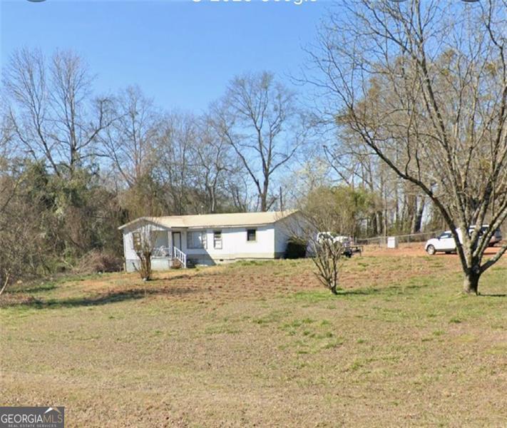 Welcome to 37 Carruth Road in charming Jefferson, GA! This well-cared-for 3-bedroom, 1-bath ranch offers the perfect blend of comfort, space, and opportunity. Sitting on a generous 1.37-acre lot, this property is move-in ready with room for TLC to personalize and make it your dream home. Inside, you'll find a functional layout with a spacious living area, cozy kitchen, and plenty of natural light. Enjoy the expansive, level lot-perfect for outdoor living, entertaining, or expansion. With 1.37 acres of usable land, this property also presents a fantastic opportunity for builders or investors looking to subdivide and develop new homes (subject to zoning approval). Located in the desirable Jefferson City School District and just minutes from shopping, dining, parks, and I-85 access. Whether you're looking for a forever home or your next investment project, this one has the potential to deliver!