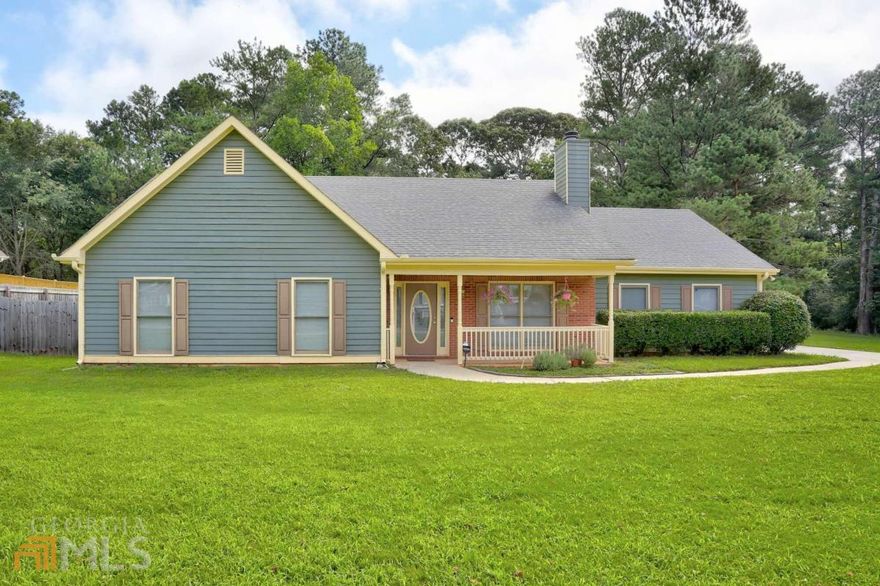 Well maintained home in the heart of sought after downtown Dacula. NO HOA. The welcoming, covered front porch lends itself as the perfect greeting into this cozy home. Upon entry you will be delighted to find newly installed flooring throughout. The open layout offers practical functionality as the fireplace anchors the space. Stainless steel appliances accent the kitchen with views to the back yard. The oversized primary suite includes a large bathroom and access to the back patio. The two guest bedrooms are generous in size. Enjoy the fenced, private back yard featuring a gorgeous extended paver patio with plenty of room for entertaining. Huge 3 car garage and extended driveway offers ample parking. Quiet neighborhood yet conveniently located.