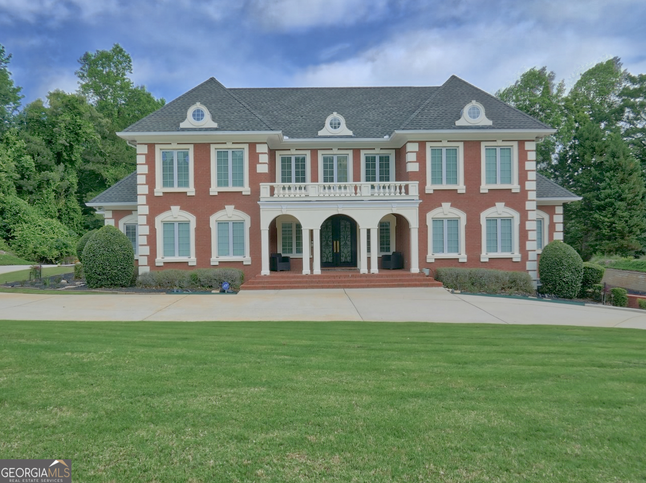 Stunning home located on the 2nd hole of the Lake Course @ Eagle's Landing Country Club. Eagle's Landing is a gated community located approximately 20 minutes from Hartsfield Jackson International Airport and 40 minutes from downtown Atlanta. Medical facilities, schools and shopping are 5 minutes away. The floor plan of this home provides several options for family living, entertaining or multi generational living. The stunning grand foyer with dual staircases sets the tone for what you will find in this extraordinary property. The foyer is flanked by a formal living room and a formal dining room. Beyond the foyer is the large great room and adjacent sunroom overlooking the golf course and the in-ground pool and spa. A large kitchen with tons of cabinets, granite counters, island and separate breakfast area opens into another living area. The primary bedroom is located on the main level and is adorned with a tray ceiling and sitting area. The primary bathroom is oversized and boasts dual vanities, dressing area, jetted tub, steam shower and 2 custom closets. The 2nd level has two large suites with full bathrooms and an additional 2 bedrooms with a full jack-n-jill styled bathroom. A media area is also located on the 2nd level. The terrace level is finished with a 2nd kitchen, bar, large theater room, family room, exercise room and more. Several options for outdoor living space can be found on the deck accessible from the main living area and the terrace level. The pool and spa are surrounding by concrete decking with plenty of room for chairs, etc. Interior features include wood flooring, expansive trim, 2nd laundry in terrace level, and more. A membership to Eagle's Landing Country Club is available.