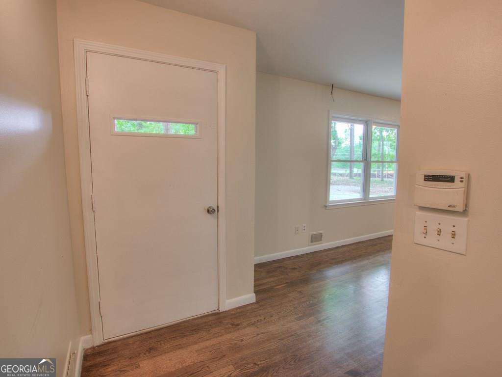 Great location just off Crabapple, surrounded by million dollar homes. Fantastic schools. 1.1 +/- acre lot with partially fenced yard (great for pets). New paint and carpet. Recent roof. Hardwoods. Plenty of storage. 3 bedrooms/2 baths all on main level.