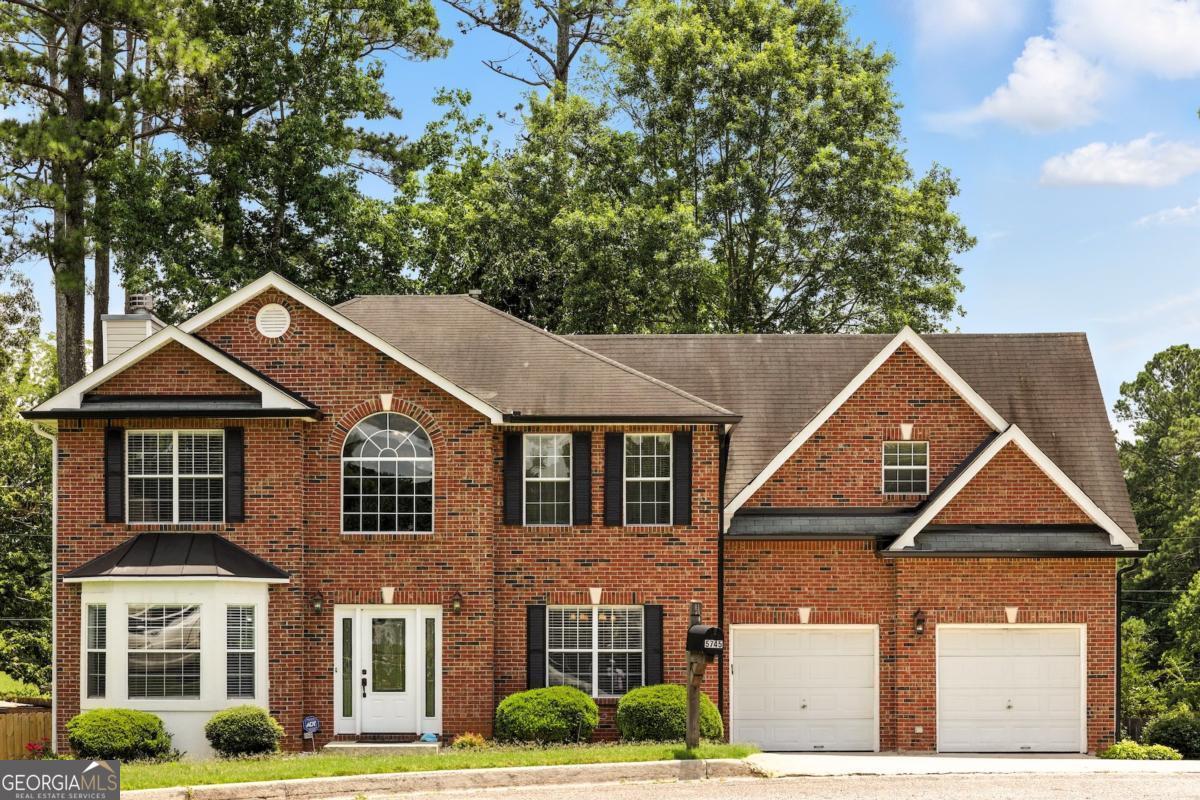 Welcome to this beautifully maintained 4-bedroom, 2.5-bathroom home, nestled in a peaceful cul-de-sac in the heart of Powder Springs. Featuring a charming brick front exterior, this property offers both privacy and access to nearby nature, including a scenic lake perfect for fishing and boating. Step inside to a welcoming foyer, with a formal dining room to the right and a flex/guest room to the left. The hallway leads into an open-concept kitchen and living area, perfect for entertaining and everyday living. The kitchen boasts ample cabinetry and natural light, all overlooking the cozy family room. Upstairs, you'll find an oversized primary suite complete with a full bathroom featuring a separate shower and soaking tub, along with dual vanities. Three additional generously sized bedrooms and a full hall bath provide plenty of space for family or guests. Enjoy the outdoors in the large backyard, ideal for play, relaxation, or hosting gatherings. Located near a tranquil lake, this home offers a unique balance of comfort and recreation. Don't miss the chance to make this serene retreat your new home-schedule a private tour today!