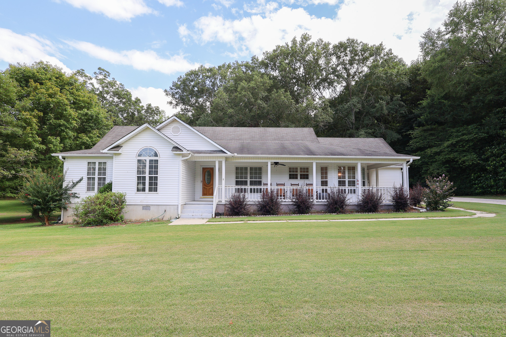 Discover the charm of country living at 8278 Lower Thomaston Road, just minutes from Lake Tobesofkee. This peaceful 3-bedroom, 2-bath home sits on 2 acres and offers the perfect blend of comfort and character. Relax on the large front porch that wraps around to the side, ideal for enjoying the quiet surroundings. Inside, the cozy living room features a classic brick fireplace, and the screened-in back porch provides a great space to unwind or entertain. Enjoy the privacy of rural living with convenient access to Macon amenities!