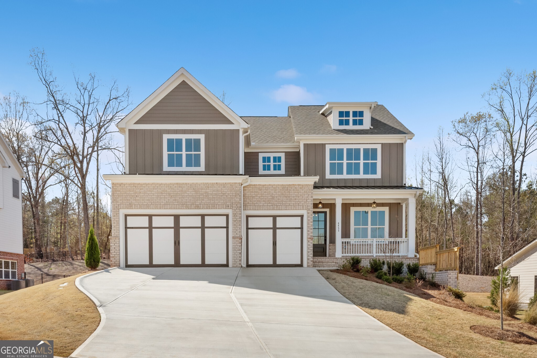 The Longwood plan built by Peachtree Residential. Quick Move-in! Lakeside serenity just got better! This gorgeous 5 bedroom basement home welcomes you with a wide foyer leading into an airy, open floor plan feel with large family room equipped with a direct vent gas fireplace & overlooked by a sparkling kitchen with luxurious countertops, gas cooktop, under cabinet lighting, and more. Rounding out the main level is a spacious guest bedroom with full bath. Upstairs you will find your immense private retreat accented with striking wood beams and accompanied by a spa-like bathroom with humungous tiled shower, and shimmering free standing tub. Three other secondary bedrooms each with full bath cap off the upstairs. A full basement with exterior entry awaits down stairs for you to fulfill your imagination. Outside you will find the perfect covered deck ready for you to enjoy those perfect summertime sunsets. Don't miss out on your opportunity to get in on one of the most coveted communities in Cumming. Call TODAY!