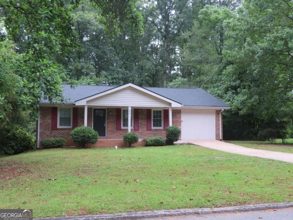 Great ranch home on a 1 acre lot! Covered porch! Spacious living room! Separate dining room! Kitchen features sleek gray cabinets, stone counters, and stainless steel appliances! Bonus room can be used as additional bedroom, living space, play room, you name it! Three spacious bedrooms, one full bathroom, and one half bathroom! Rear deck overlooks backyard! Close to shopping, dining, entertainment, and public transportation! A must see! Don't miss out!