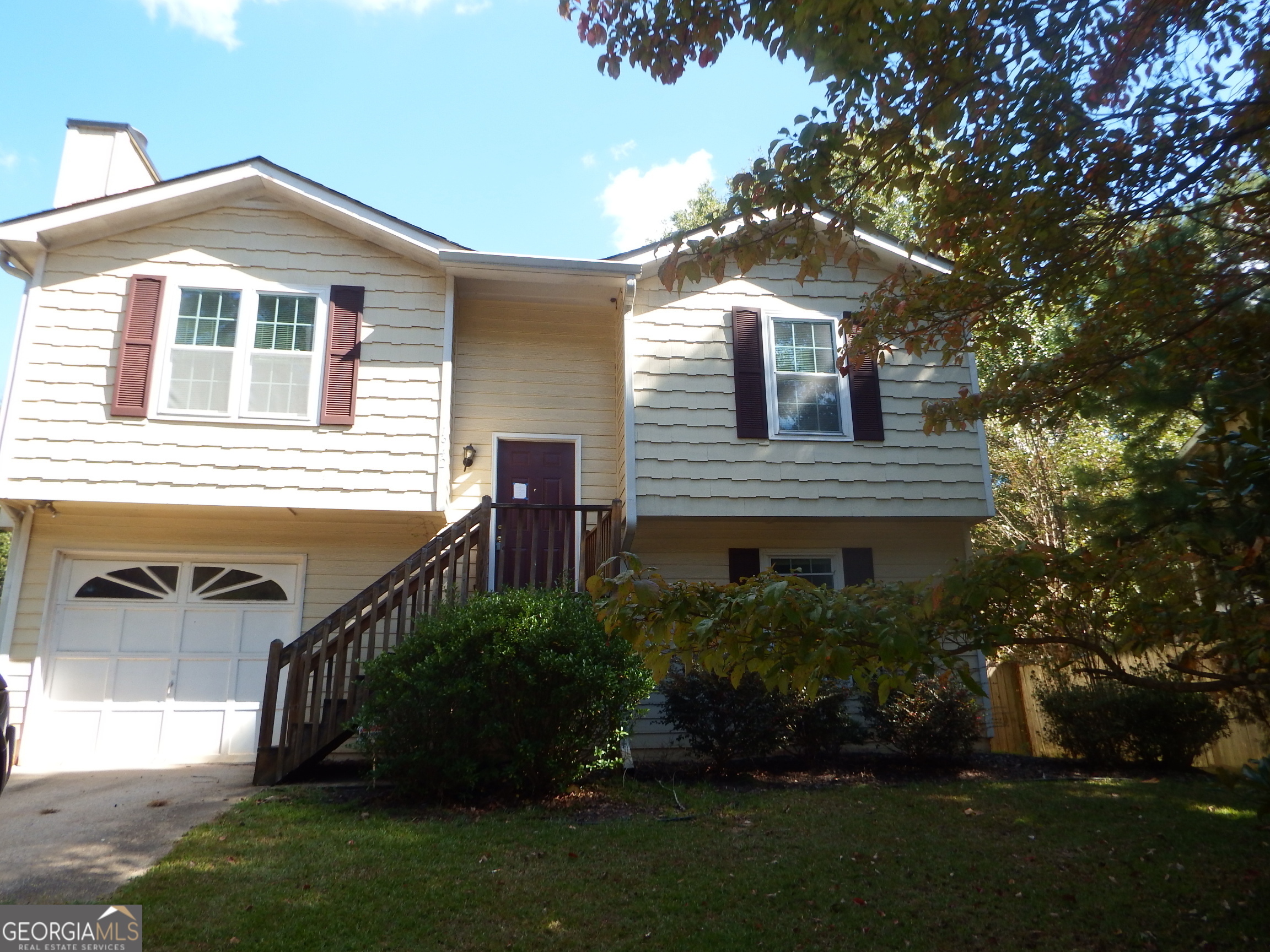 Cute. Quiet. Cozy. Take a Look at this 3 bedroom 2 bath split level home No HOA fees. An open concept family room with a fireplace and a view from the Kitchen. Step outside to relax on the front porch. Includes 2-car garage parking for your added convenience Perfectly situated close to shopping & transporation. Don t Delay to take Advantage of this Unique Opportunity