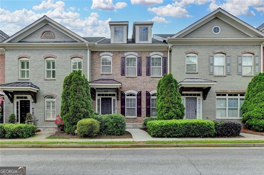 Welcome home to this immaculate, well maintained, 3 Bedroom, 2.5 bath townhome in the highly sought after Jamestown neighborhood, located in South Forsyth county minutes from GA-400.  Jamestown is one of the most desirable gated communities in the area  known for classic architecture and close proximity to Halcyon, Avalon, Downtown Alpharetta, Windward Corridor, and Johns Creek with an Alpharetta address and Forsyth County taxes. Exercise enthusiasts will enjoy the convenience of the Fulton Co and Forsyth Co Greenway trails, both within walking distance from this lovely townhome. There are gorgeous hardwood floors on both levels with an open main living floorplan. The large functional  kitchen features a spacious island, granite countertops, stylish sleek white hardwood cabinets with gorgeous hardware and lighting.  Enjoy the cozy three sided fireplace from the kitchen, dining and living areas.  Just off the kitchen is a lovely courtyard patio perfect for fresh air entertaining. Upstairs laundry is convenient to the three bedrooms and two full baths. The primary suite offers a peaceful escape, complete with custom walk-in closet, an ensuite bathroom with large soaking tub, separate shower, dual vanities, and a water closet with added storage.  The two car garage has added overhead space maker steel storage racks, and most convenient is a guest parking lot located directly behind the garage, with enough green space for a quick dog walk. This lovely community features a resort style pool, clubhouse, lighted tennis/pickleball courts, sidewalks and seasonal landscaping. Don't miss this opportunity in Jamestown where the living is nice and easy in every way. Originally developed by the award winning Providence group.