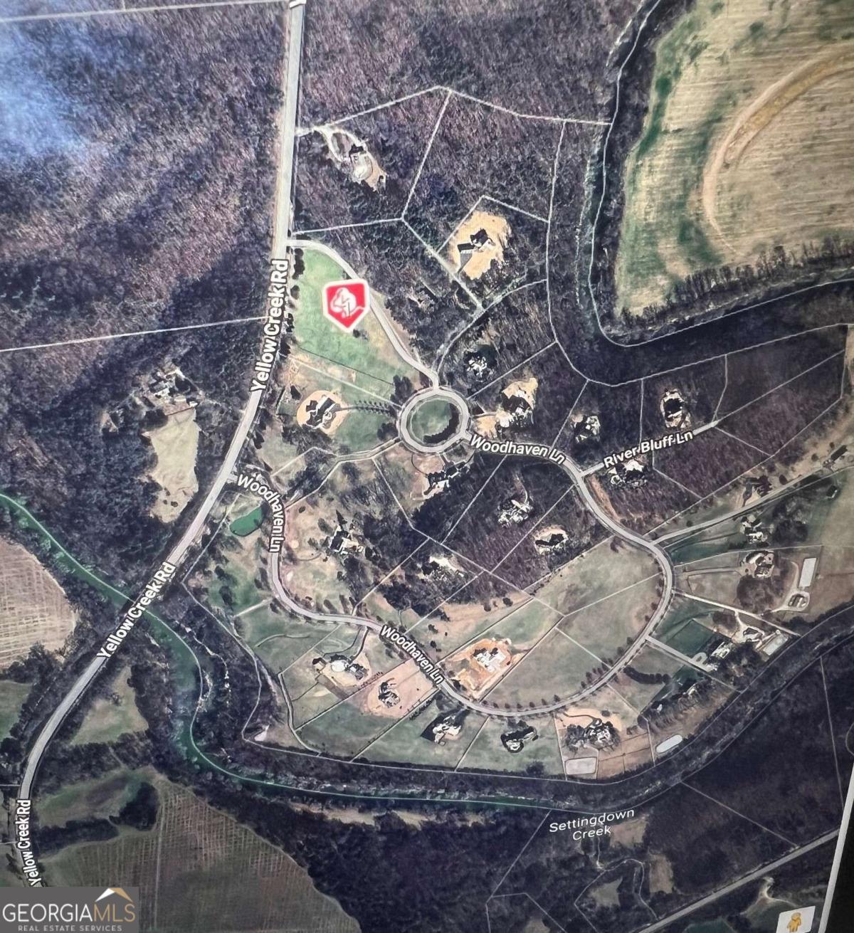 Gorgeous 6.4 acre pasture estate lot waiting to welcome you and your builder. Woodhaven Bend is a gated sanctuary of 32 custom estate home sites located on the Etowah River. This peaceful community offers walking and riding trails, a boat ramp for access to the Etowah River, and beautiful rustic pavilions along the nature trails for community events and enjoyment. Centrally located near Ball Ground, Canton, Woodstock, Milton, Cumming, and Dawsonville. Come and see this beautiful lot and community to build your dream home.
