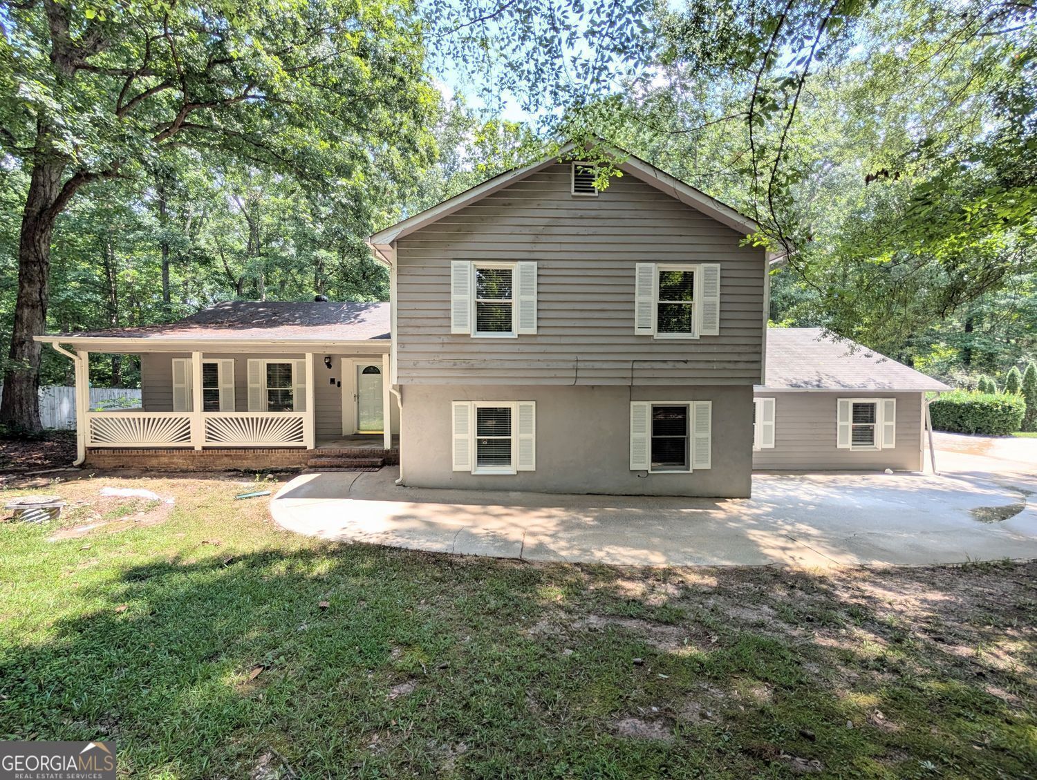 This home is eligible for Special 100% financing with NO PMI & below market rates. With plenty of living space on a full acre, this home offers comfort and convenience. Inside, you'll find a bright living room with a fireplace and an open floor plan. The main areas feature updated LVP, tile floors, hardwood stairs and newer carpet in the bedrooms for a fresh, move-in-ready feel. The kitchen and dining areas provide plenty of room for everyday living and entertaining. A covered patio overlooks the large backyard, giving you space to relax. The split-level layout includes generous bedrooms and three full bathrooms. A two-car garage and extended driveway offer ample parking and storage. Located close to Fayetteville Pavilion, shopping, restaurants, theme parks, and the airport, this home combines privacy and convenience.