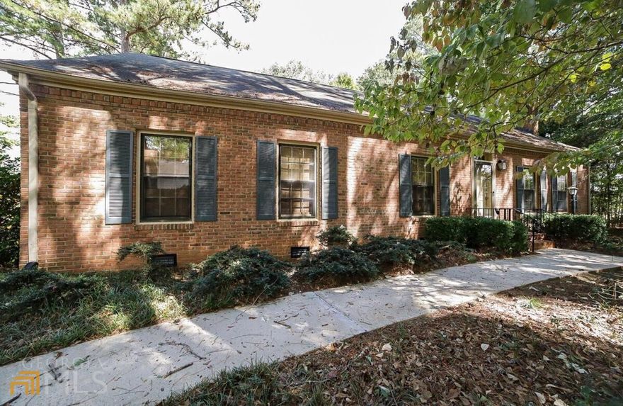 Presenting Athens coveted, all-owner-occupied, Drayton Square community. A rare find, this corner lot package is ready to impress! Boasting lush landscaping, mature shade trees, convenient guest parking, and a more private setting, this limited opportunity to occupy a 3 bedroom/ 2 bath, detached end-unit is hard to beat! Boasting a single-level patio home offering a formal concept, this expansive design offers one of the larger footprints available in the community. This gracious plan is adorned with multiple windows providing ample natural light throughout, boasts hardwood and carpet flooring, decorative light fixtures, and custom built-ins. Upon entry you are received by the oversized living room. Ideal for entertaining, this grand living space hosts a masonry fireplace flanked by custom built-ins, and is adorned with custom focus lighting to highlight your favorite art piece. Dinner parties are made easy with the spacious dining room that could easily seat 6+. Double French doors from the dining room access the jewel of this home, the oversized sunroom. With 180 degrees of windows and a custom, built-in entertainment center, this magnificent living area is ideal for hosting game day gatherings or simply relaxing with a good book. Spanning the rear of the home, the sunroom is large enough to lend space to allow for a breakfast area as well. The updated kitchen also accesses both the dining and sunroom, allowing for easy serving and interacting with your guest. Airy and bright, the updated kitchen features an abundance of white custom cabinetry including extra pantry cabinets, sparkling granite counters, tile backsplash and a complete stainless appliance package including refrigerator. The bedrooms and baths can be found grouped together down the left hall including the owners suite. Quite oversized, this grand retreat provides plenty of space for large furniture or a sitting area, and comes complete with multiple closets, plus a private full bath. Each of the accessory bedrooms host plush carpet flooring, ceiling fan light fixtures, ample closet space, and quick access to the hall bath. Well planned, these units were designed to enjoy the outdoors with private courtyard living. Just off the sunroom you can access the brick-encompassed, courtyard patio boasting true privacy. Due to this units location, there is a quaint side yard to relish even more outdoor living. Additionally this home boasts a new water heater, newer interior paint, and a rear 2-car carport. Completing this total package is the extensive amenities. Enjoy a game of tennis or pickle ball on the tennis courts, a cool dip in the pool during the Summer months, convenient trash pickup, lawn maintenance and more. Centrally located in East Athens, and within 6 minutes to UGA, this home's convenience to everything you need adds to its ultimate desirability.