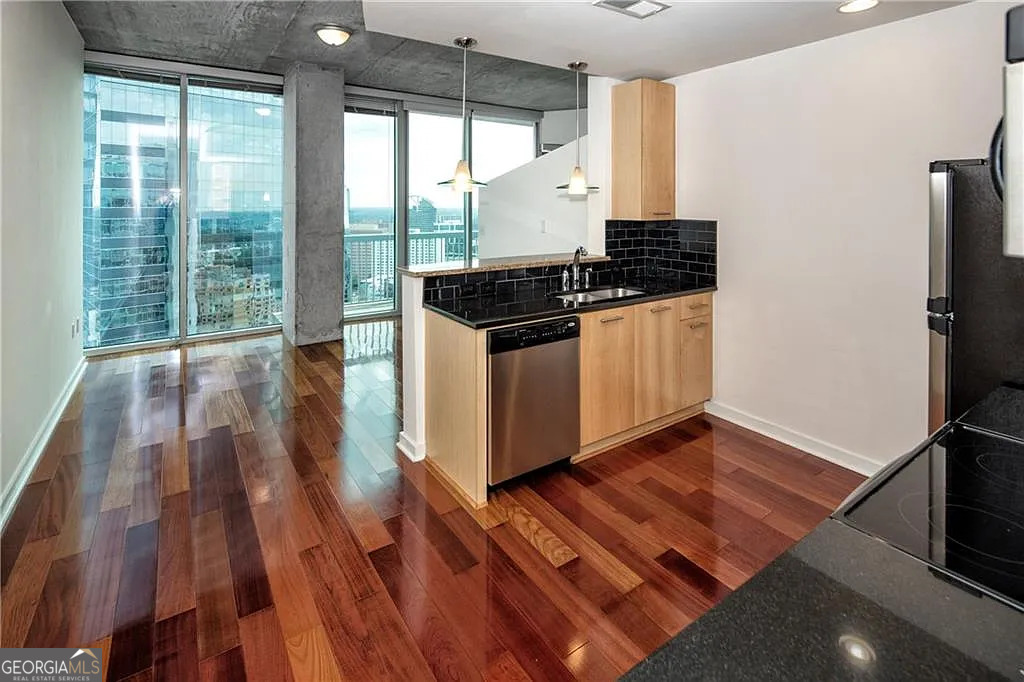Experience Elevated Living in the Heart of Buckhead - Realm Condominiums Step into Unit 2713 at Realm, a stunning 27th-floor residence where breathtaking skyline views set the stage for sophisticated city living. Floor-to-ceiling windows flood the space with natural light, creating a bright, airy retreat above the bustle of Buckhead. The open layout flows seamlessly into a sleek kitchen with granite countertops, stainless steel appliances, and abundant cabinet space-perfect for everyday living or entertaining. The spacious bedroom easily fits a king-sized bed and boasts a generous walk-in closet with in-unit laundry for convenience. This rare offering includes a transferable leasing permit, making it an ideal choice for both homeowners and investors. With a tenant already in place, it's a truly turnkey opportunity. Life at Realm comes with access to resort-style amenities: a saltwater pool with sweeping city views, outdoor grilling and firepit lounges, two clubrooms, a dog run, a state-of-the-art two-level fitness center, and 24/7 concierge service. Just steps from MARTA, PATH400, luxury shopping, top dining, and vibrant nightlife, Unit 2713 delivers the perfect balance of luxury, convenience, and lifestyle in one of Atlanta's most sought-after locations.